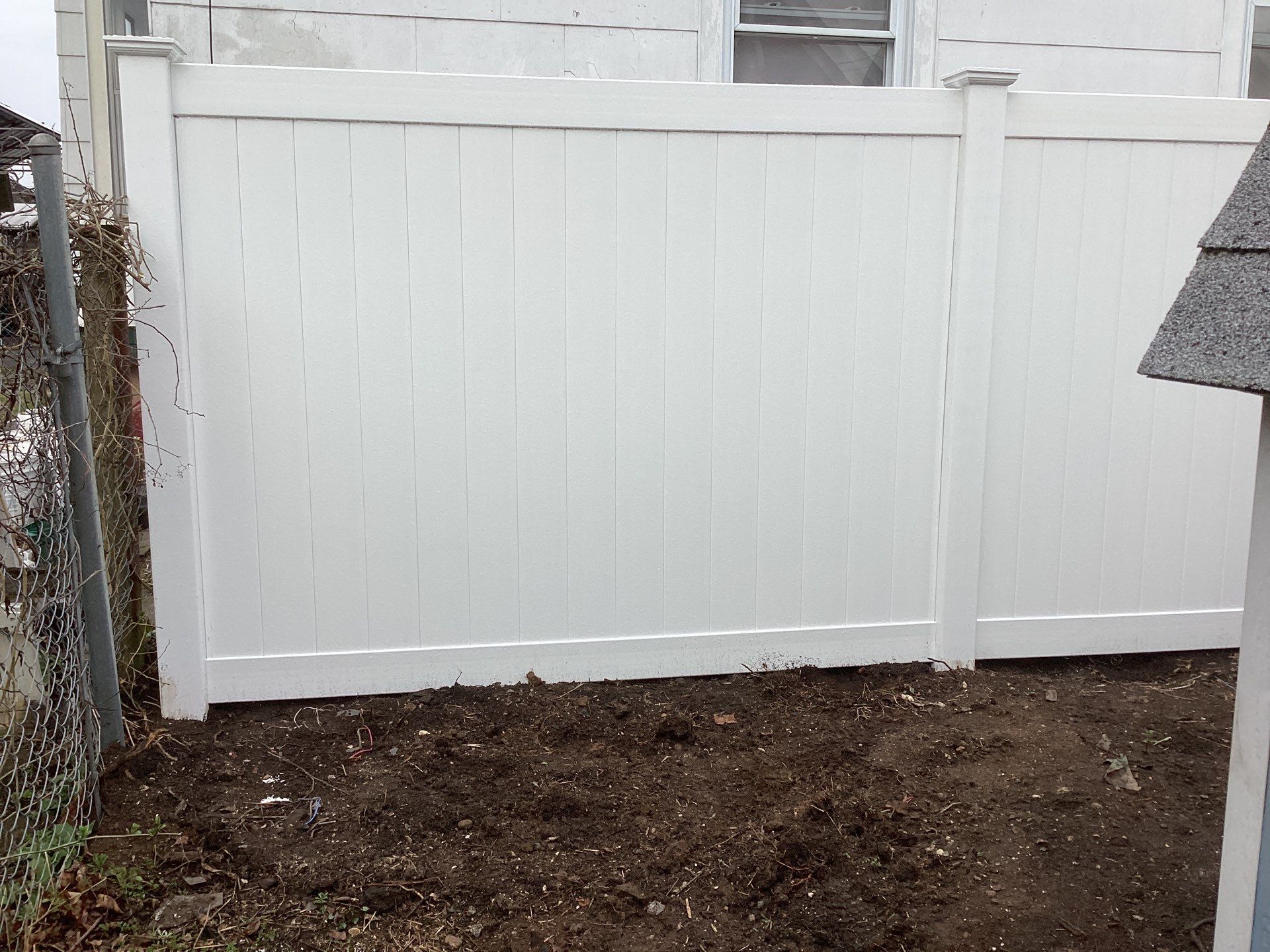 Fence replacement with white Vinyl privacy fence. by DiGiorgi Roofing and Siding Inc