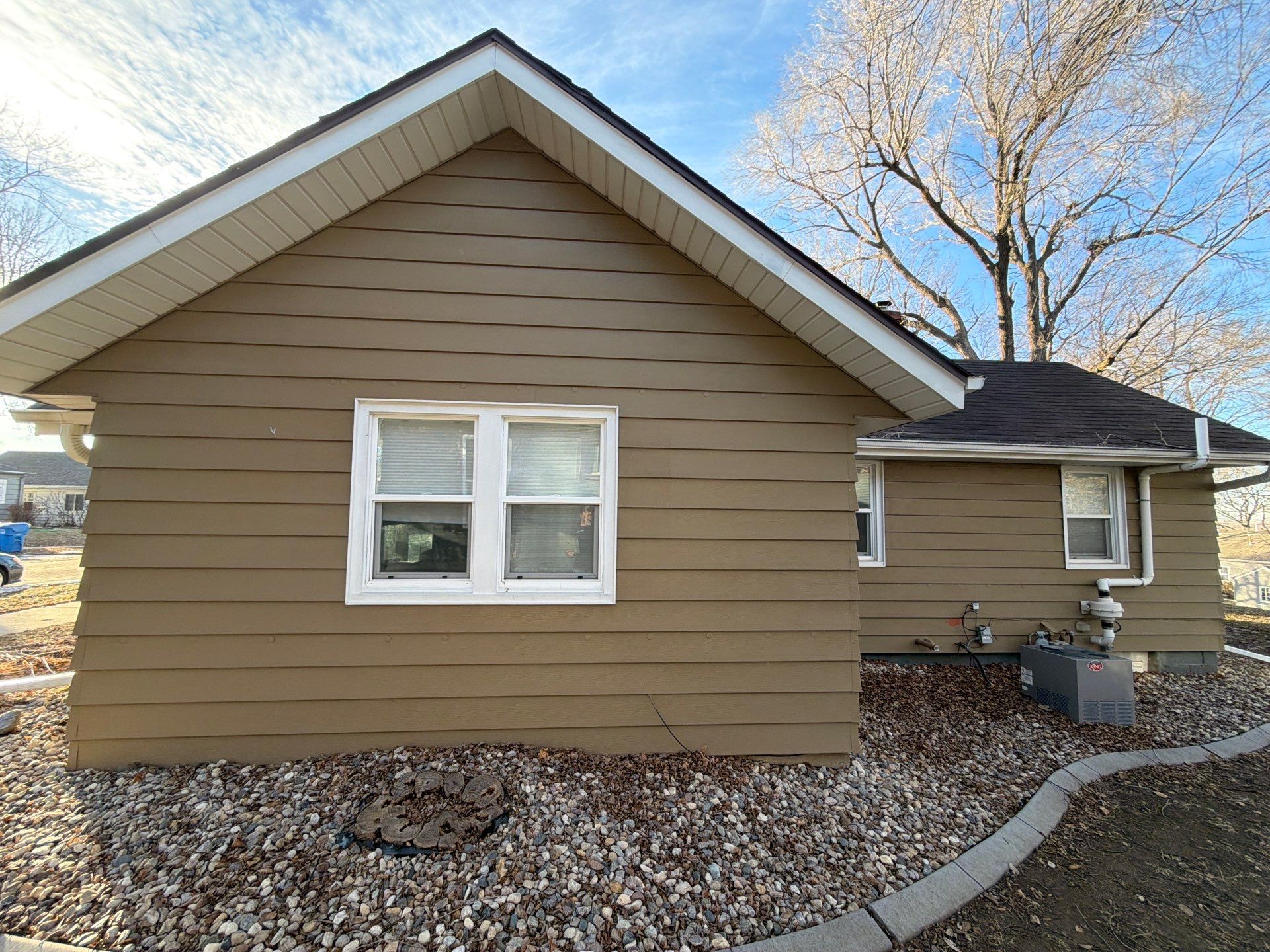 Exterior Siding Repair and Full House Repaint in Sioux Falls by Select Painting, Coatings & Garage Cabinets