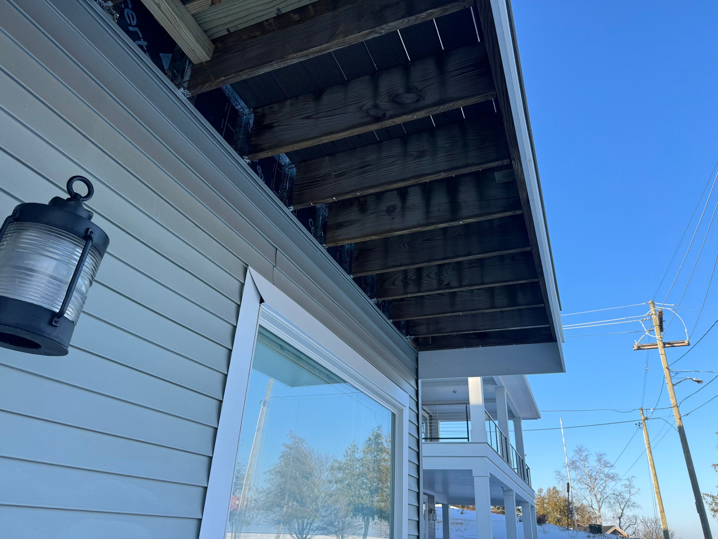 Custom Underdecking System and Soffit Installation in Charlevoix, Michigan by Rainbow Seamless Systems
