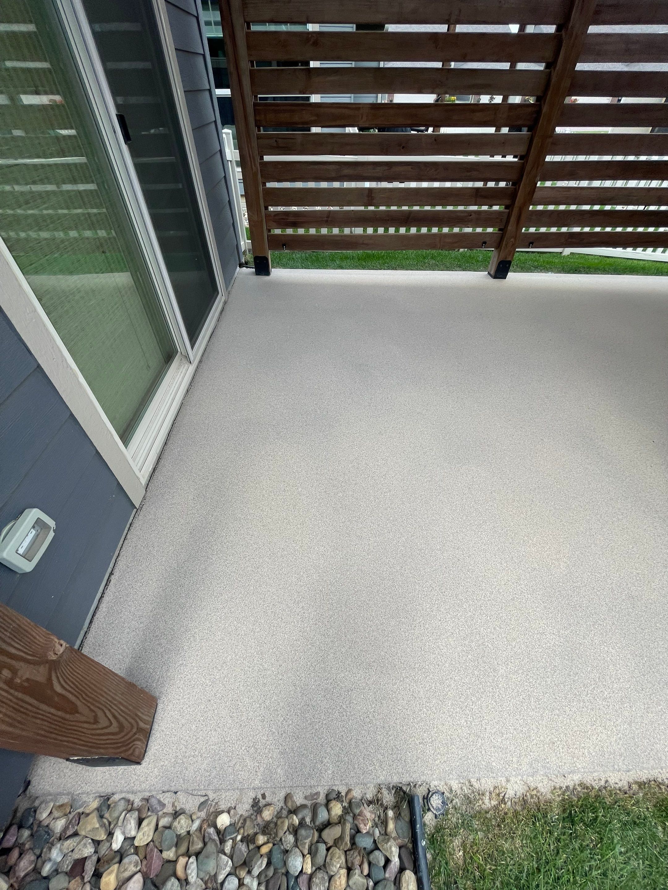 Textured Concrete Patio Coating and Custom Privacy Pergola in Sioux Falls by Select Painting, Coatings & Garage Cabinets