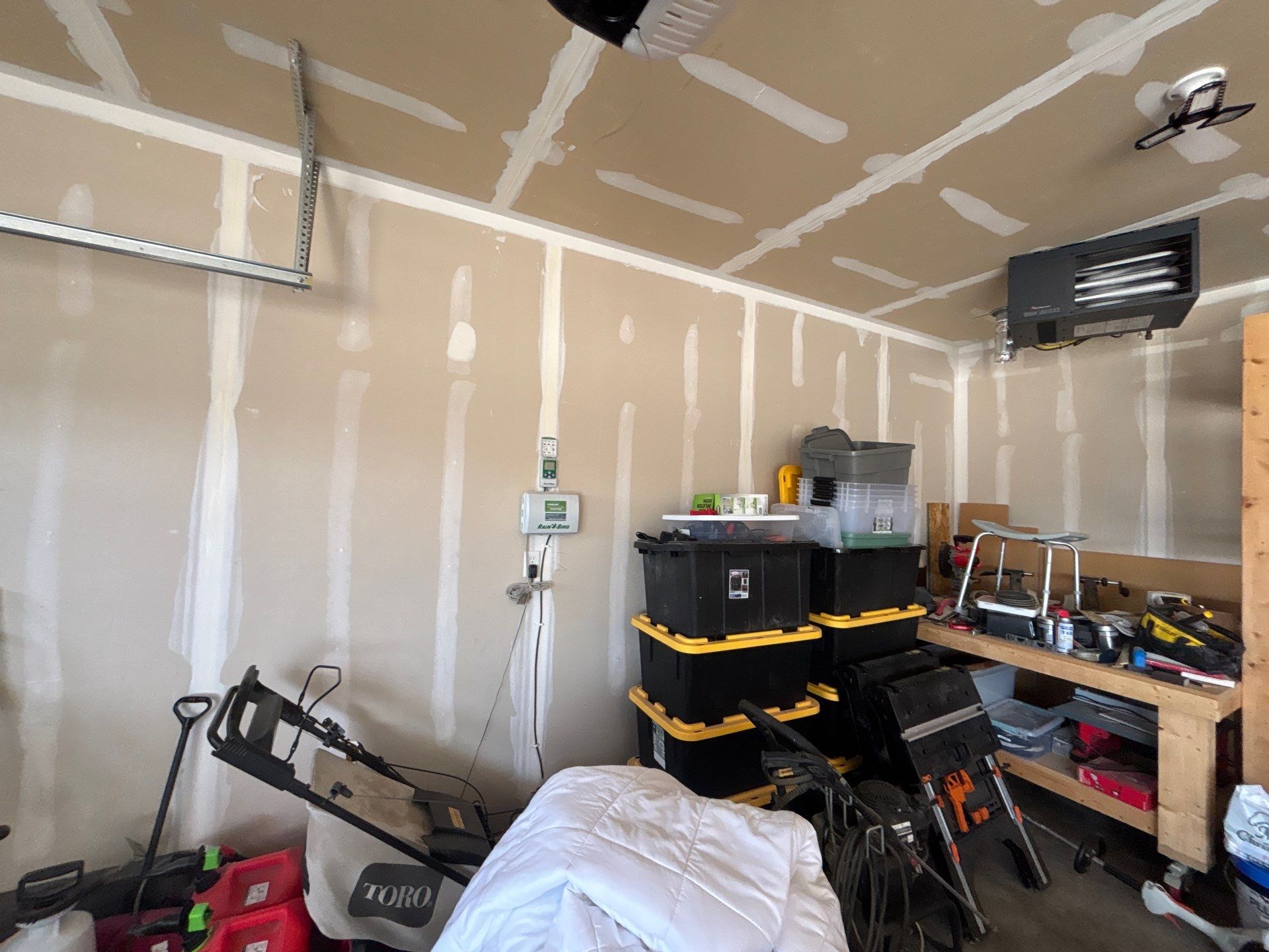 Grey Flake Epoxy Garage Floor Coating in Sioux Falls by Select Painting, Coatings & Garage Cabinets