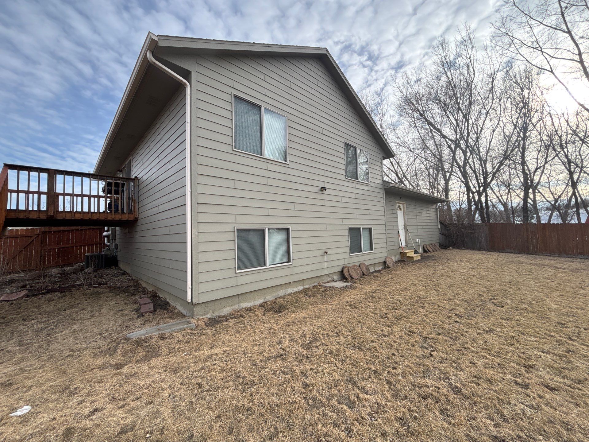 Full Exterior Residential Painting and Siding Refresh in Sioux Falls by Select Painting, Coatings & Garage Cabinets
