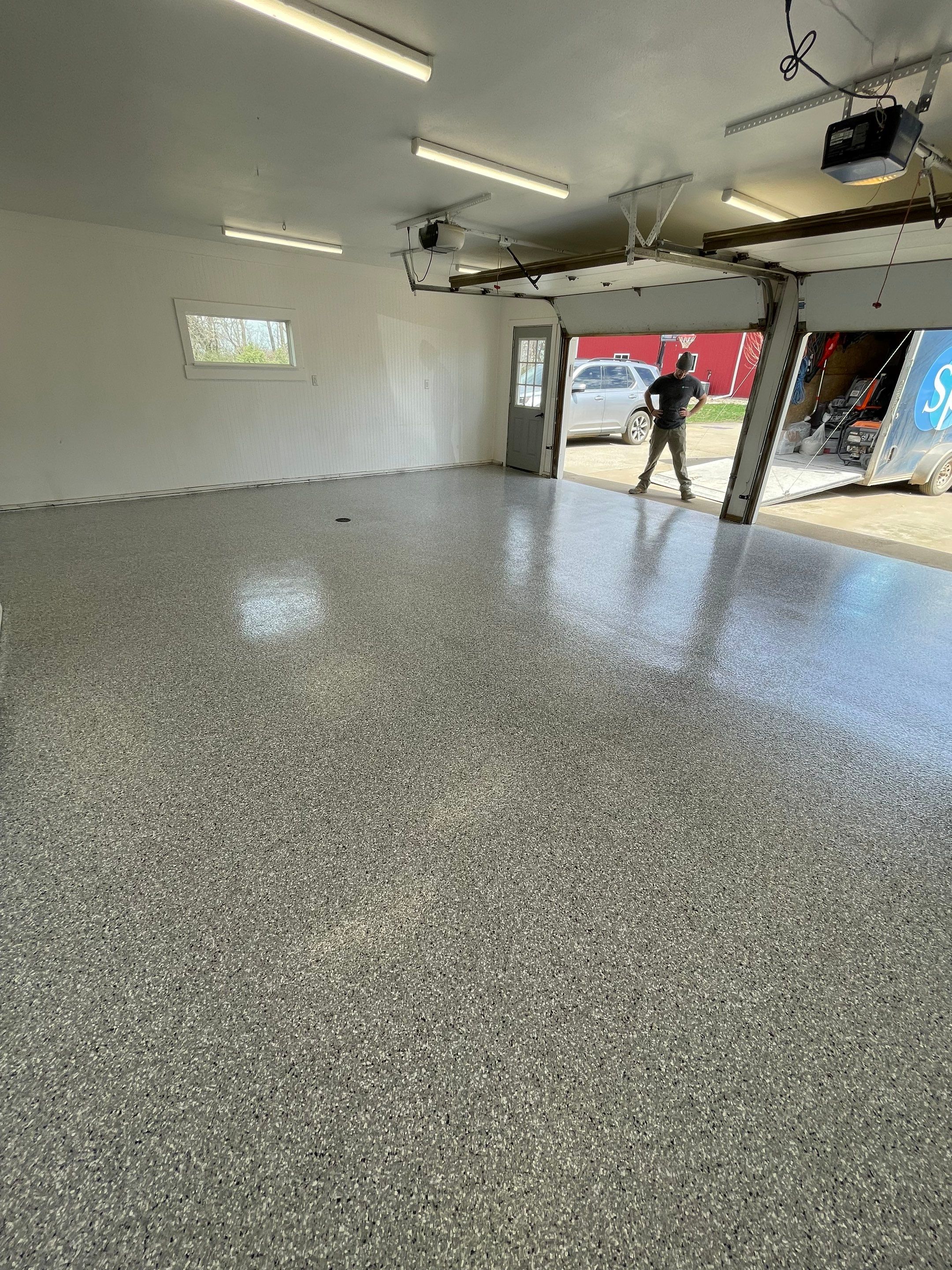 Feather Grey Garage Floor Coating and Crack Repair in Beresford by Select Painting, Coatings & Garage Cabinets