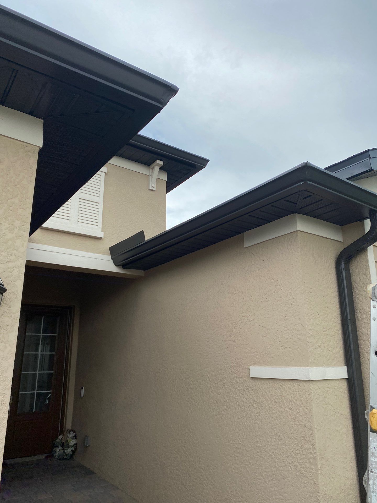 Brown Seamless Gutters for Homes in Fort Myers by Gutter Professors