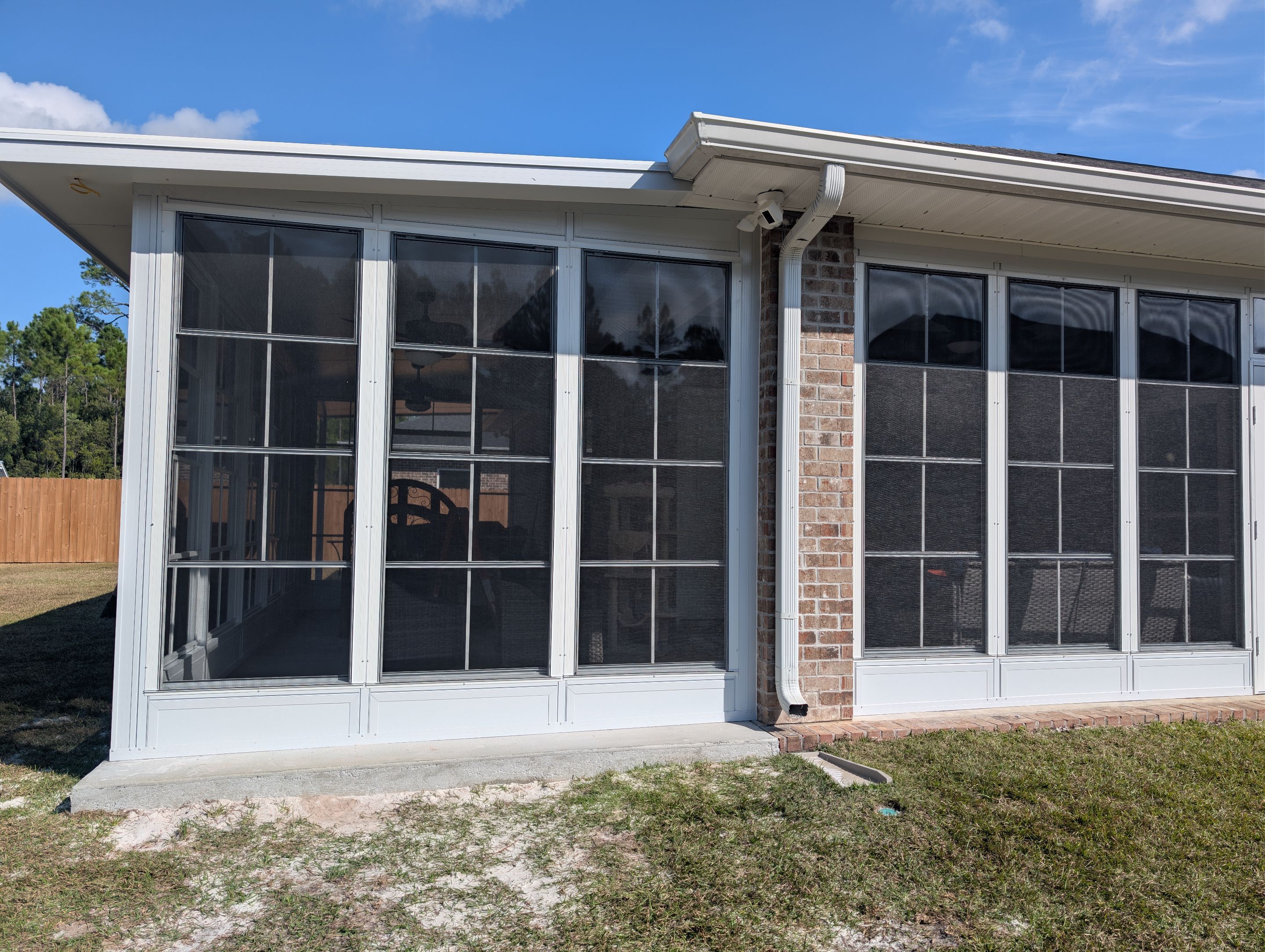 Home addition w/Vinyl 4-Track Windows by Titan Sunrooms