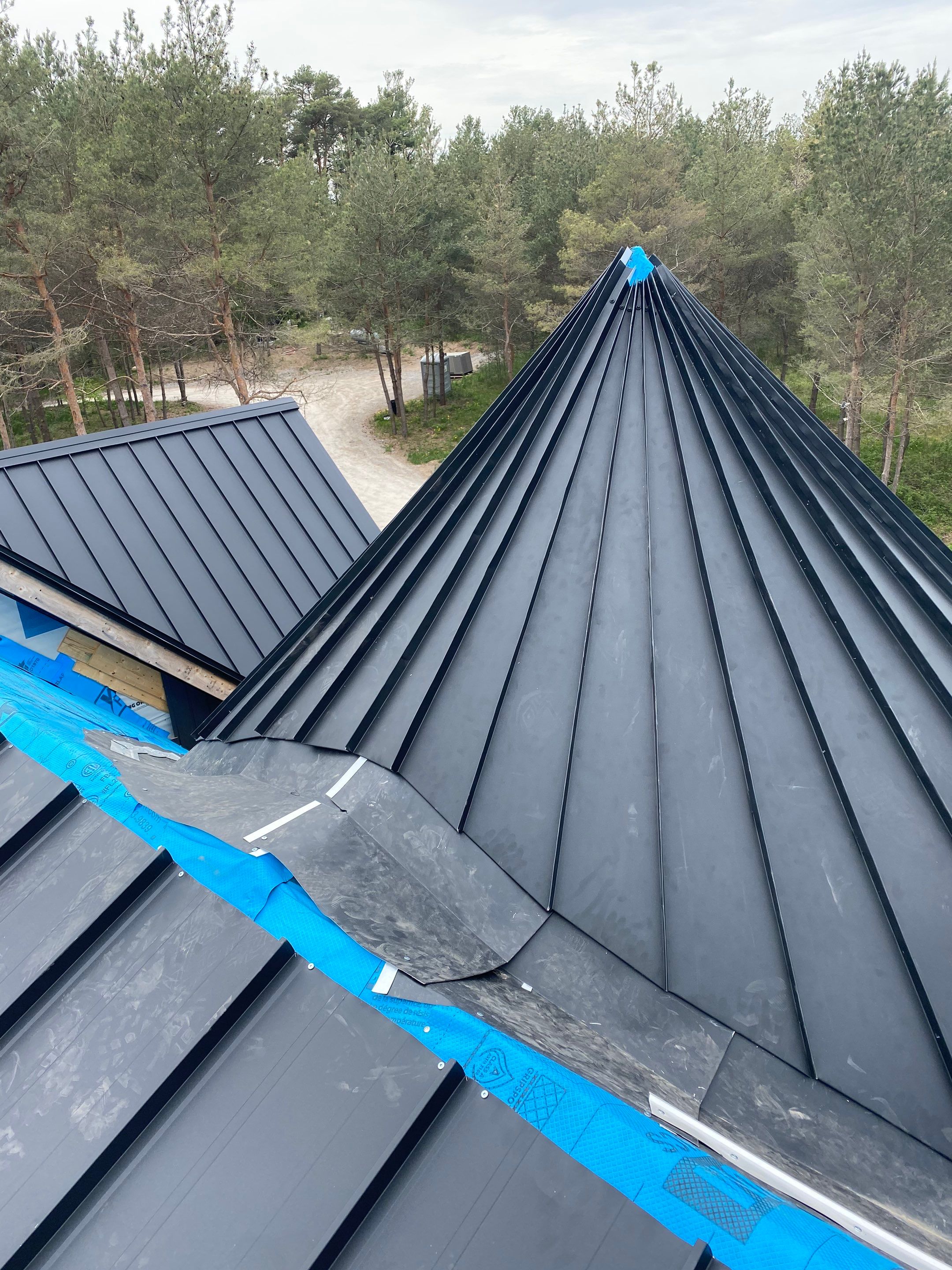 New Home Construction using 16" Standing Seam Panels by Jay Carter Roofing & Sheet Metal