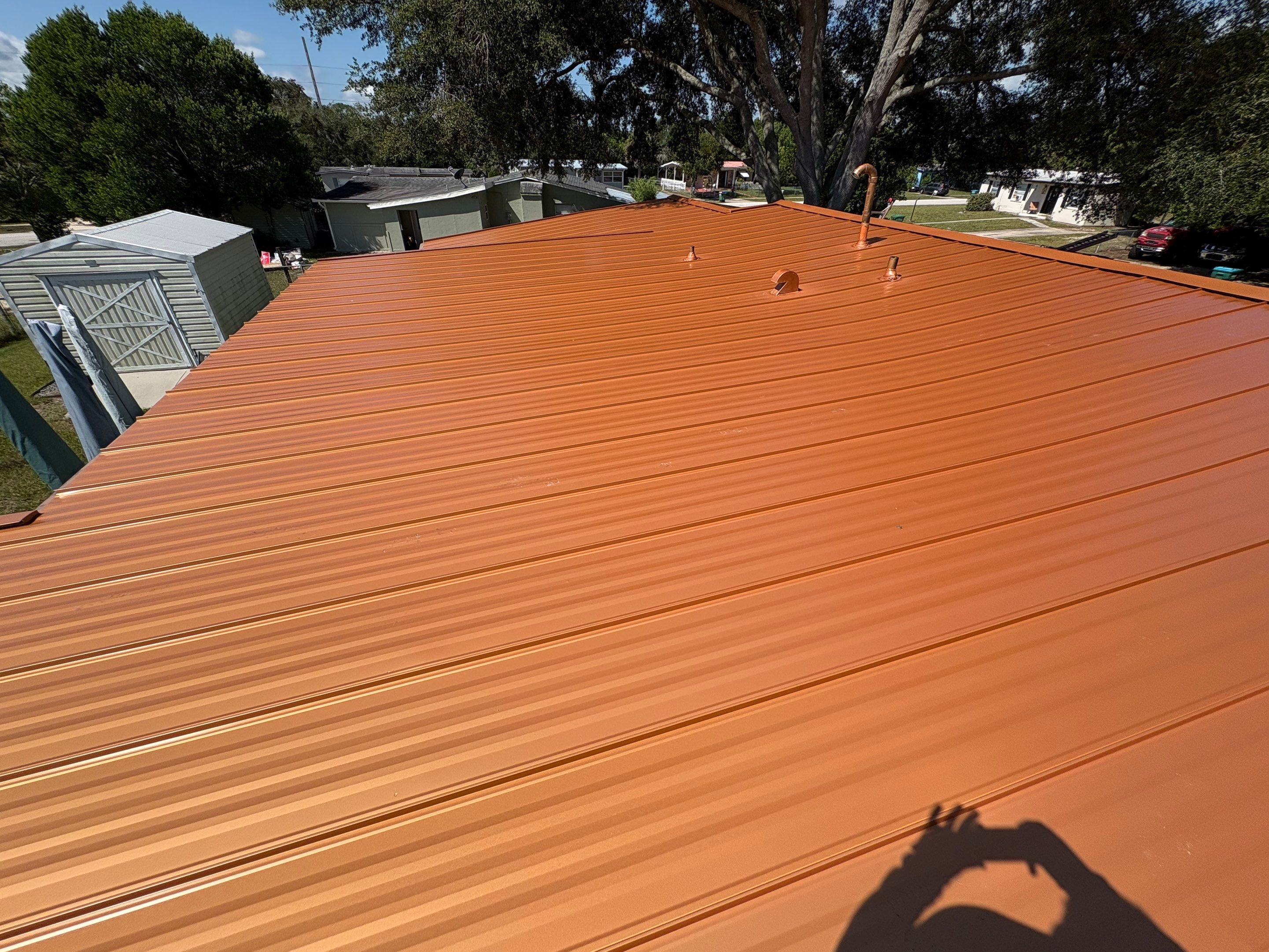 Standing Seam Metallic Copper Metal Roof Replacement in Deltona by Pinnacle Roofing Group