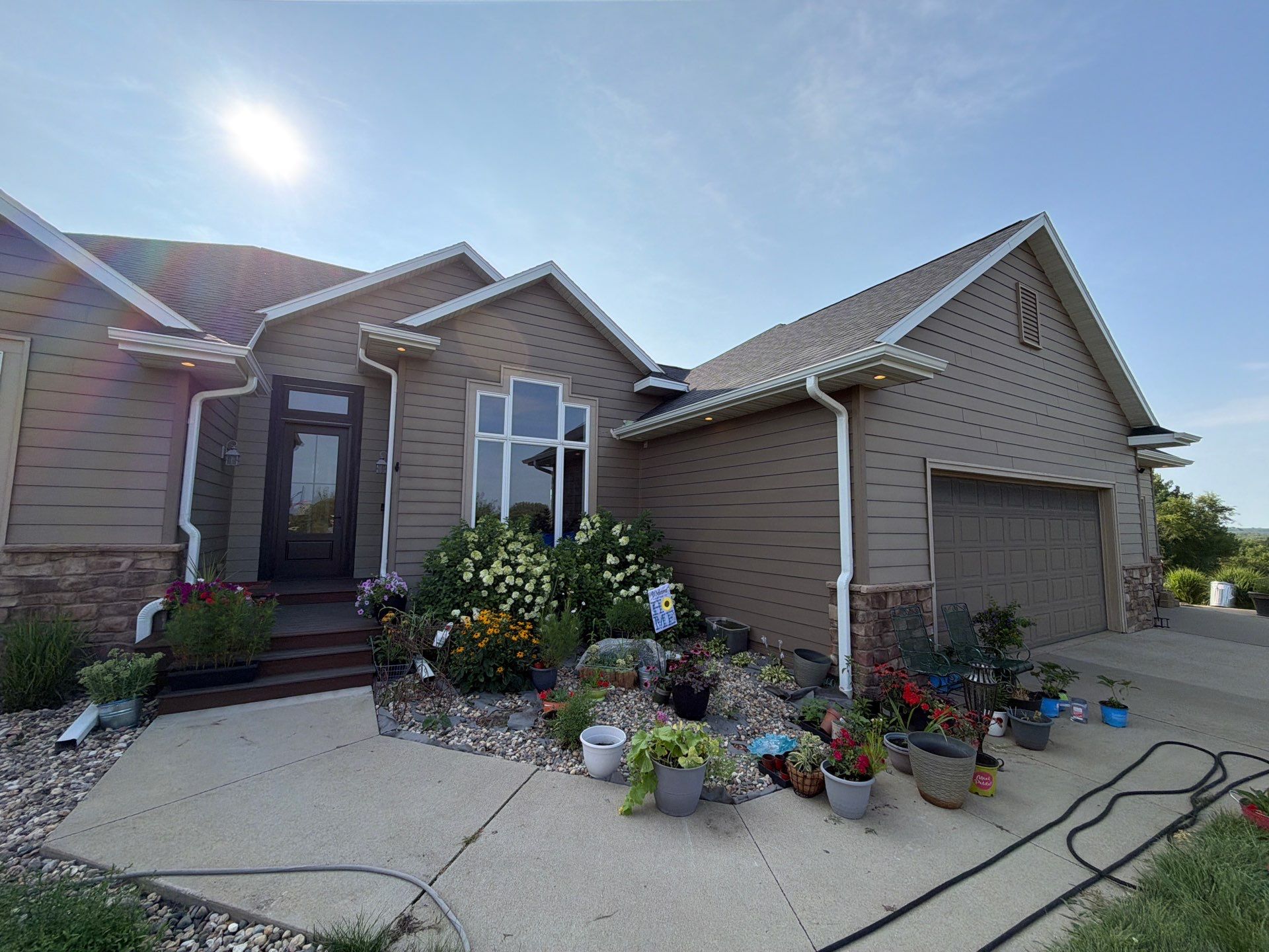 Sioux Falls Residential Exterior Painting and Siding Refresh by Select Painting, Coatings & Garage Cabinets