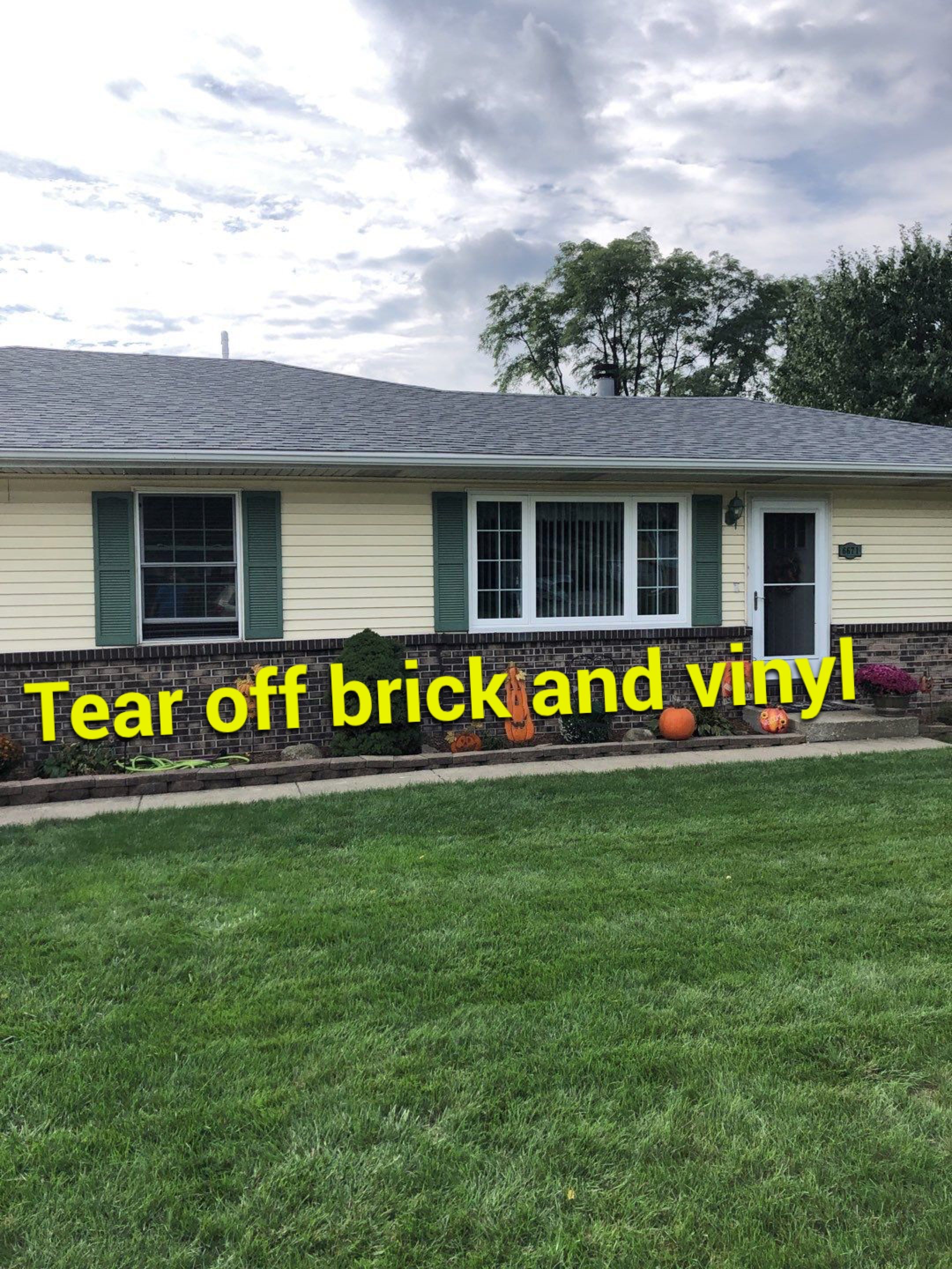 taking down brick wall & installing siding by Kraz Construction