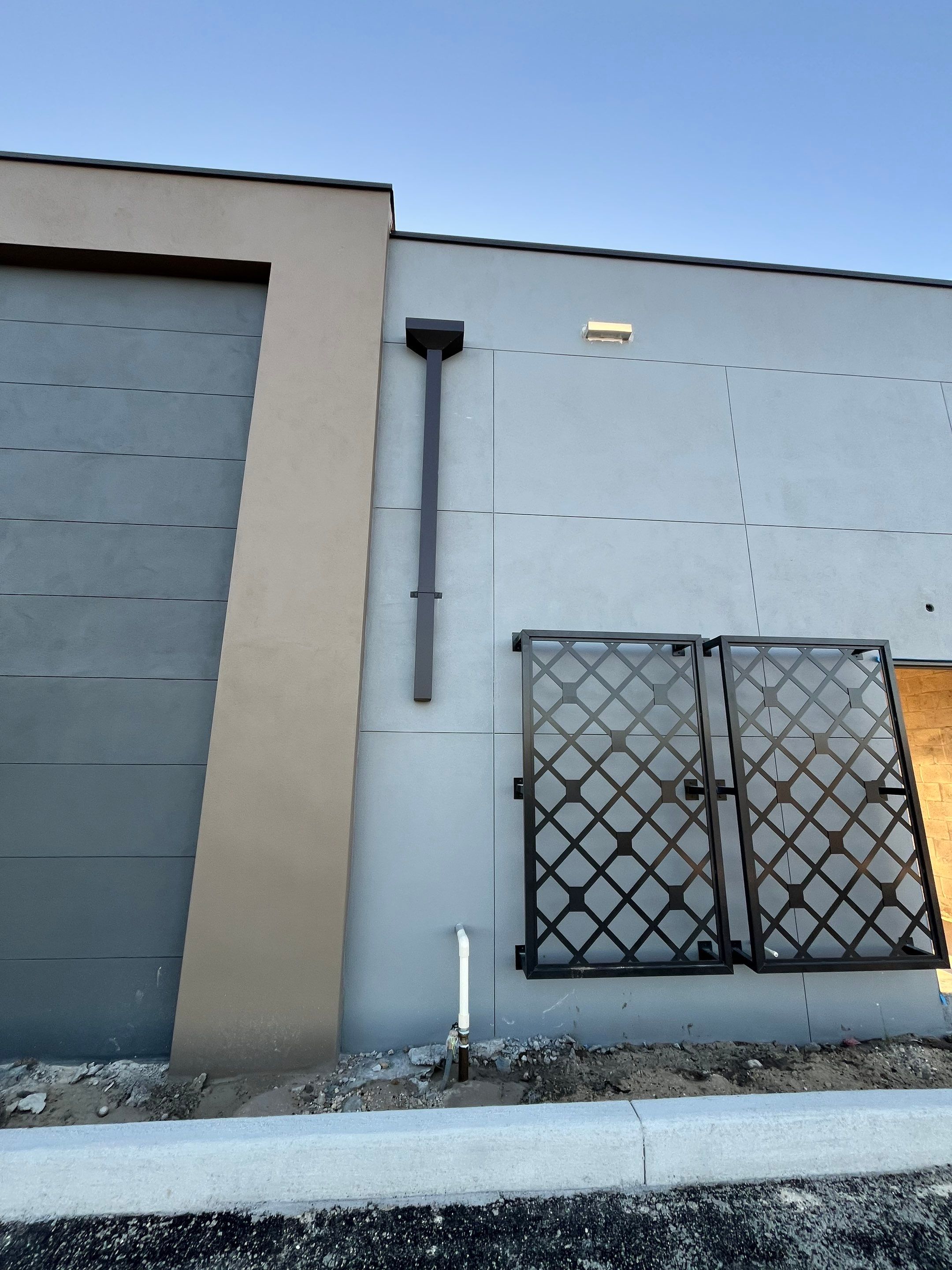 Downspout Installation using collector head in Cape Coral FL by Gutter Professors