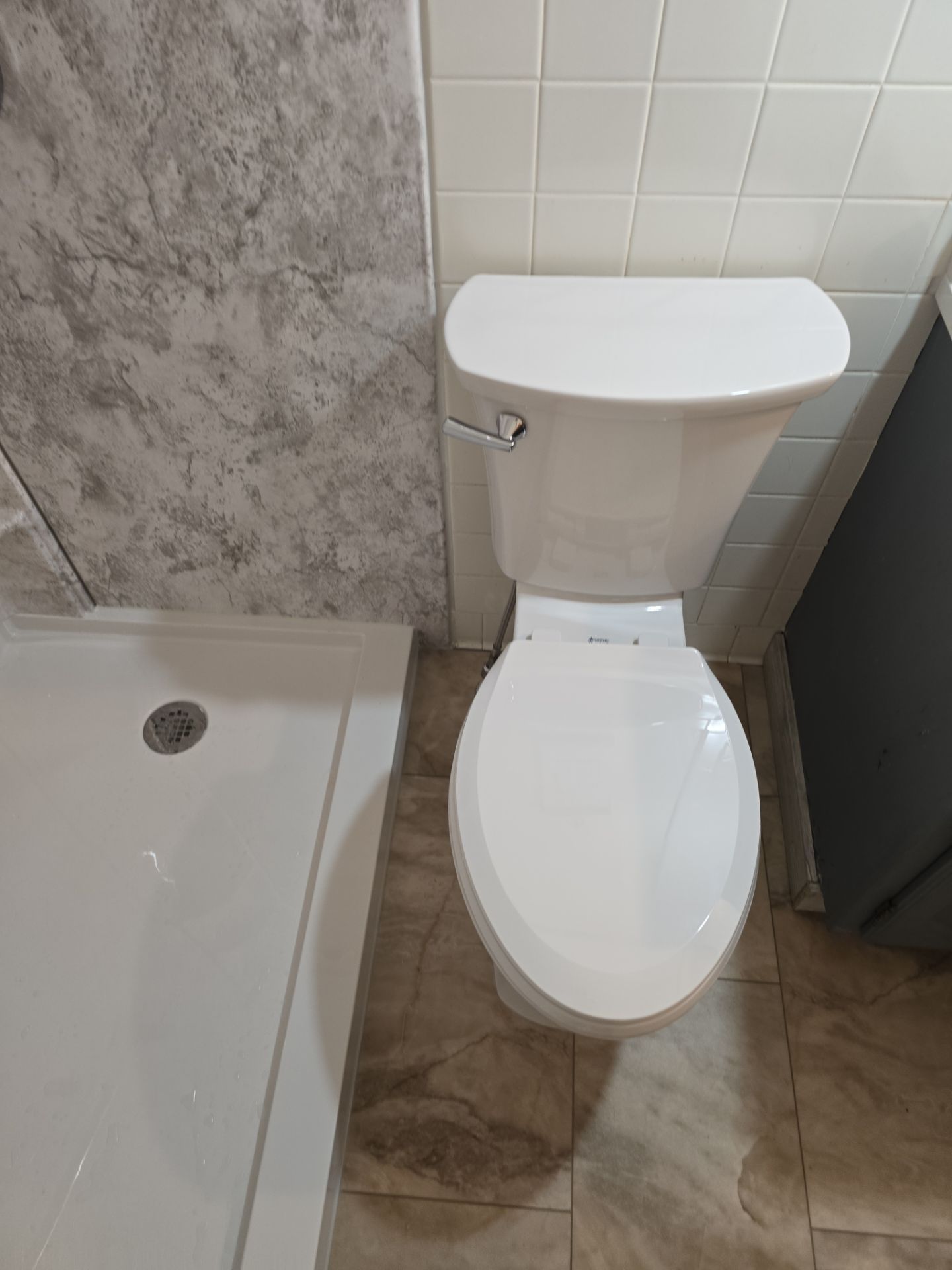 Tub to Shower , flooring, and countertop by The Shower Company
