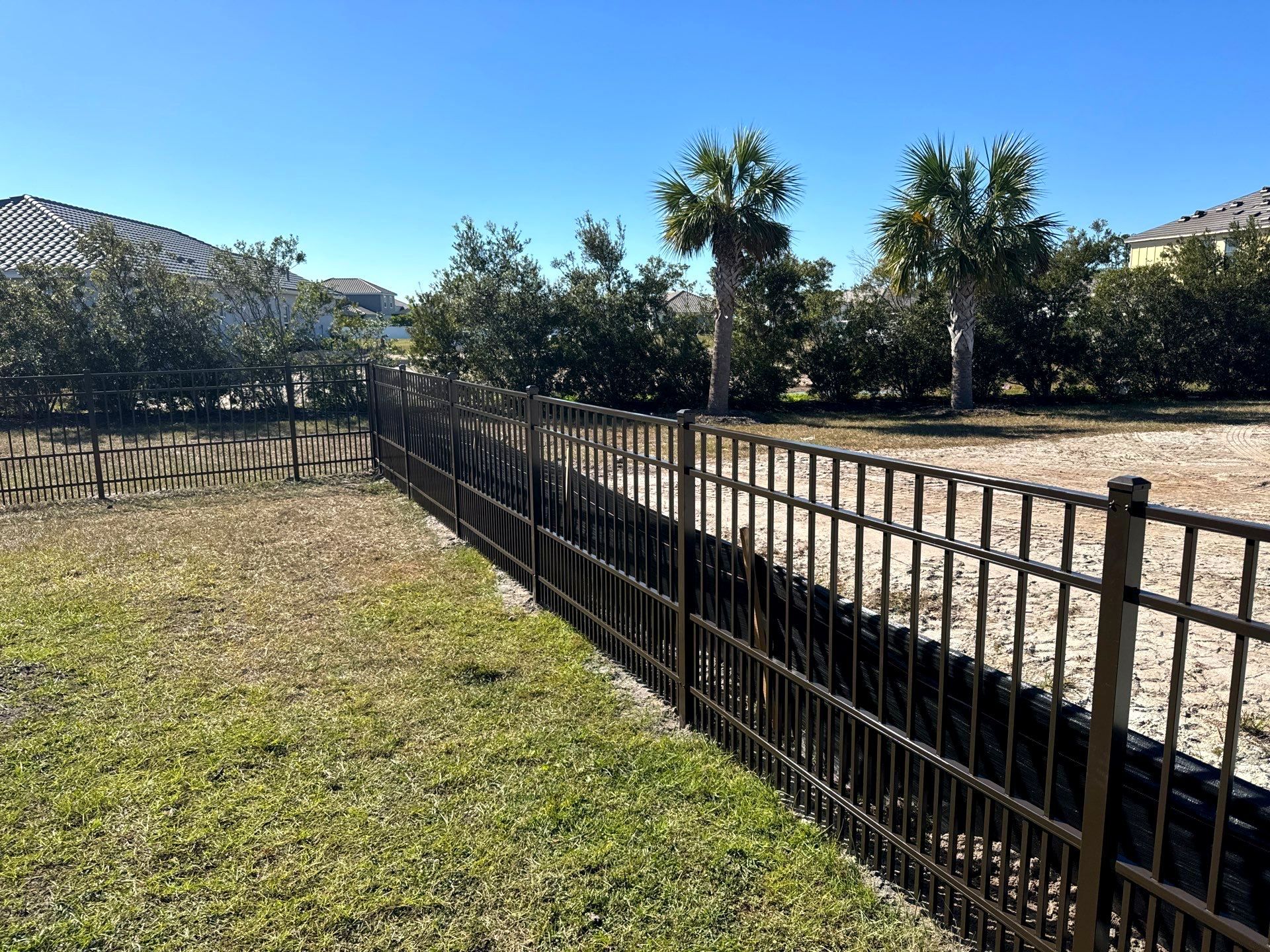 Aluminum Fence Installation using 4Ft 3 Rail Bronze Puppy Picket Aluminum Fence by Asap fence and gates, LLC