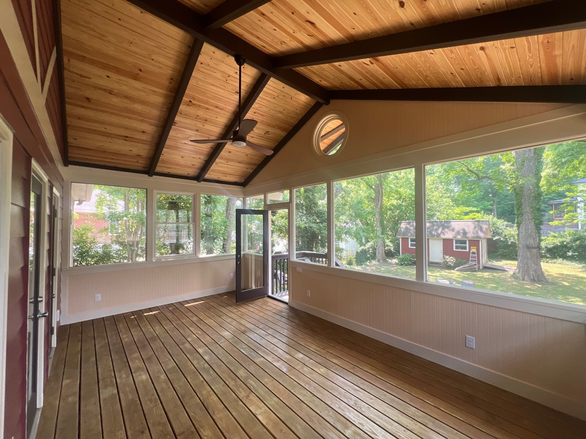 Elevated Screened-In Porch Addition with Vaulted Tongue-and-Groove Ceiling by Swift Home Renovations