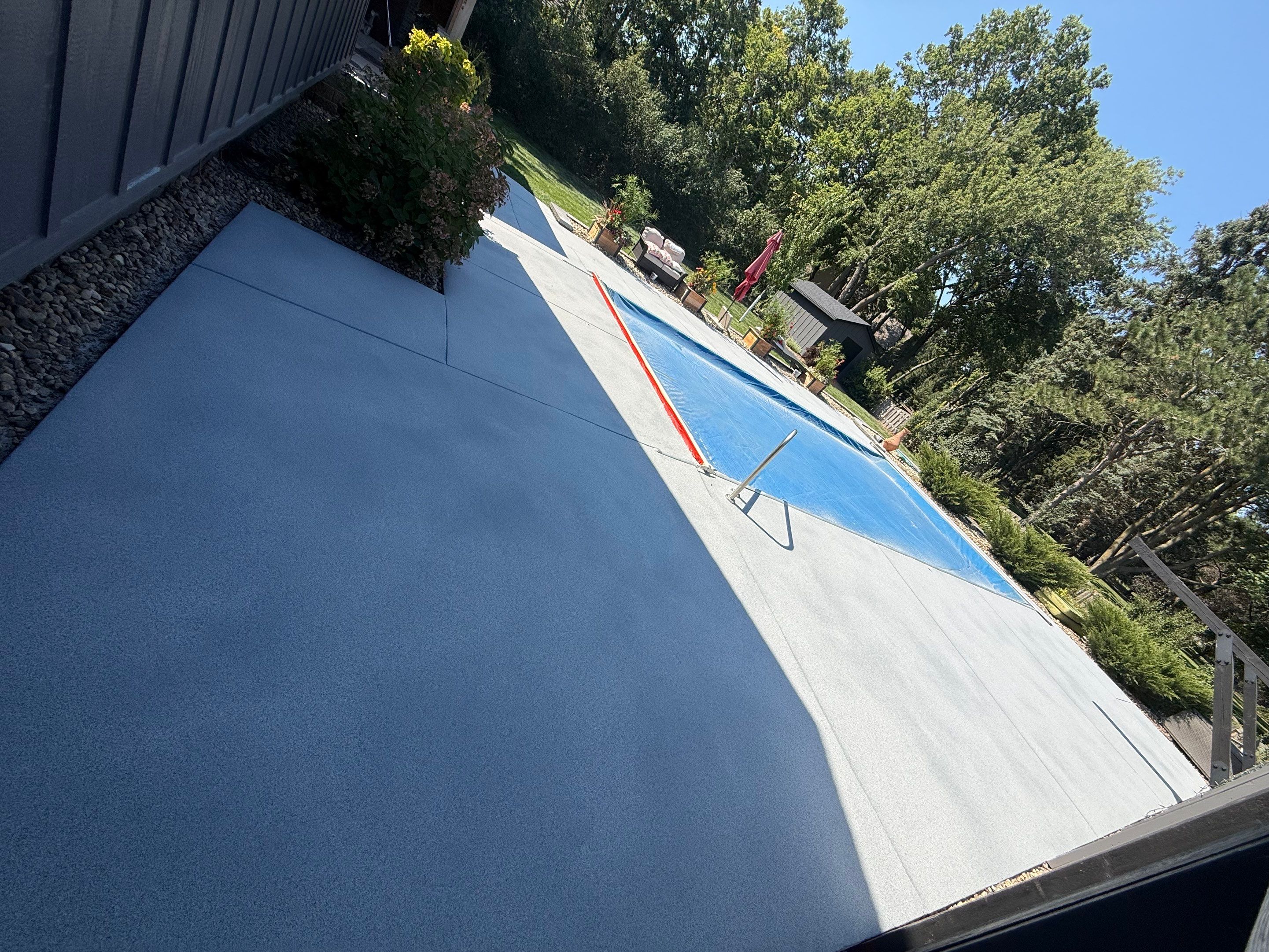 Garage Floor and Textured Pool Deck Coating in Sioux Falls by Select Painting, Coatings & Garage Cabinets