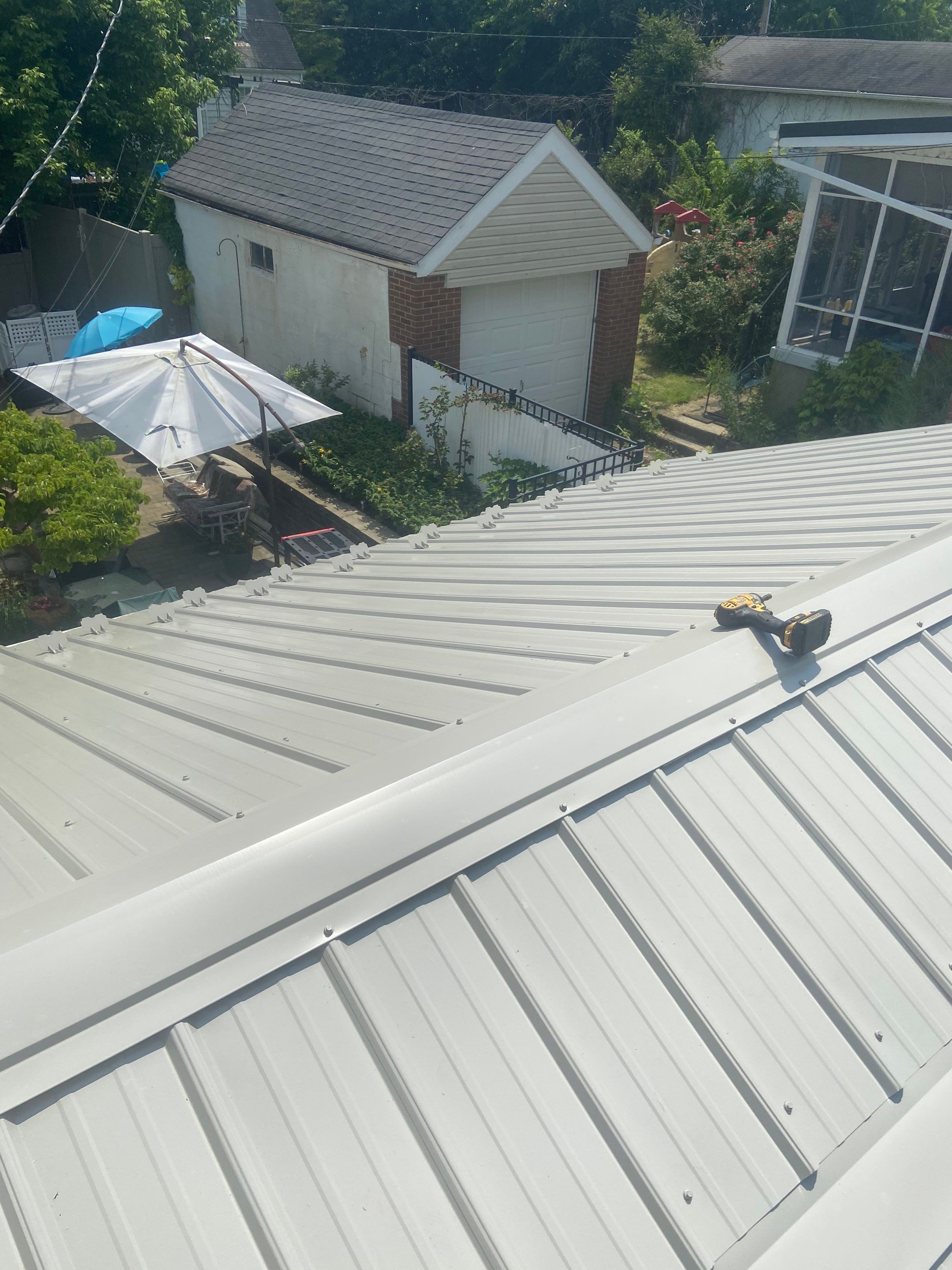 Metal Roofing, Skylights, Porch Build by Secure Construction Company Inc