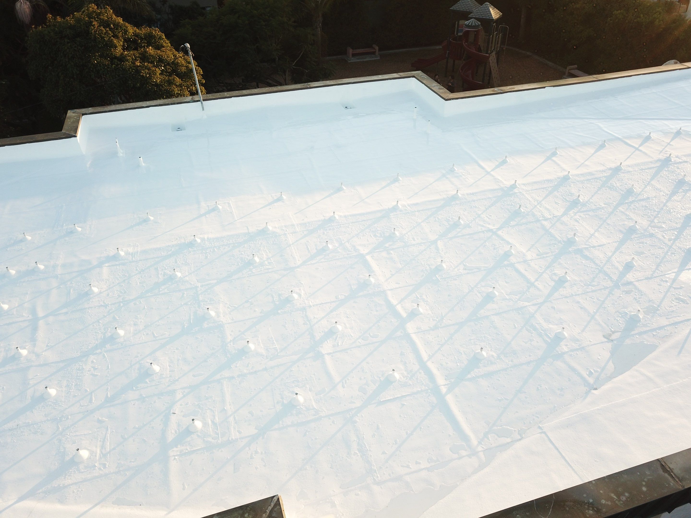 Residential Roofing Installation using ASC Silicone Membrane by Hull Brothers Roofing
