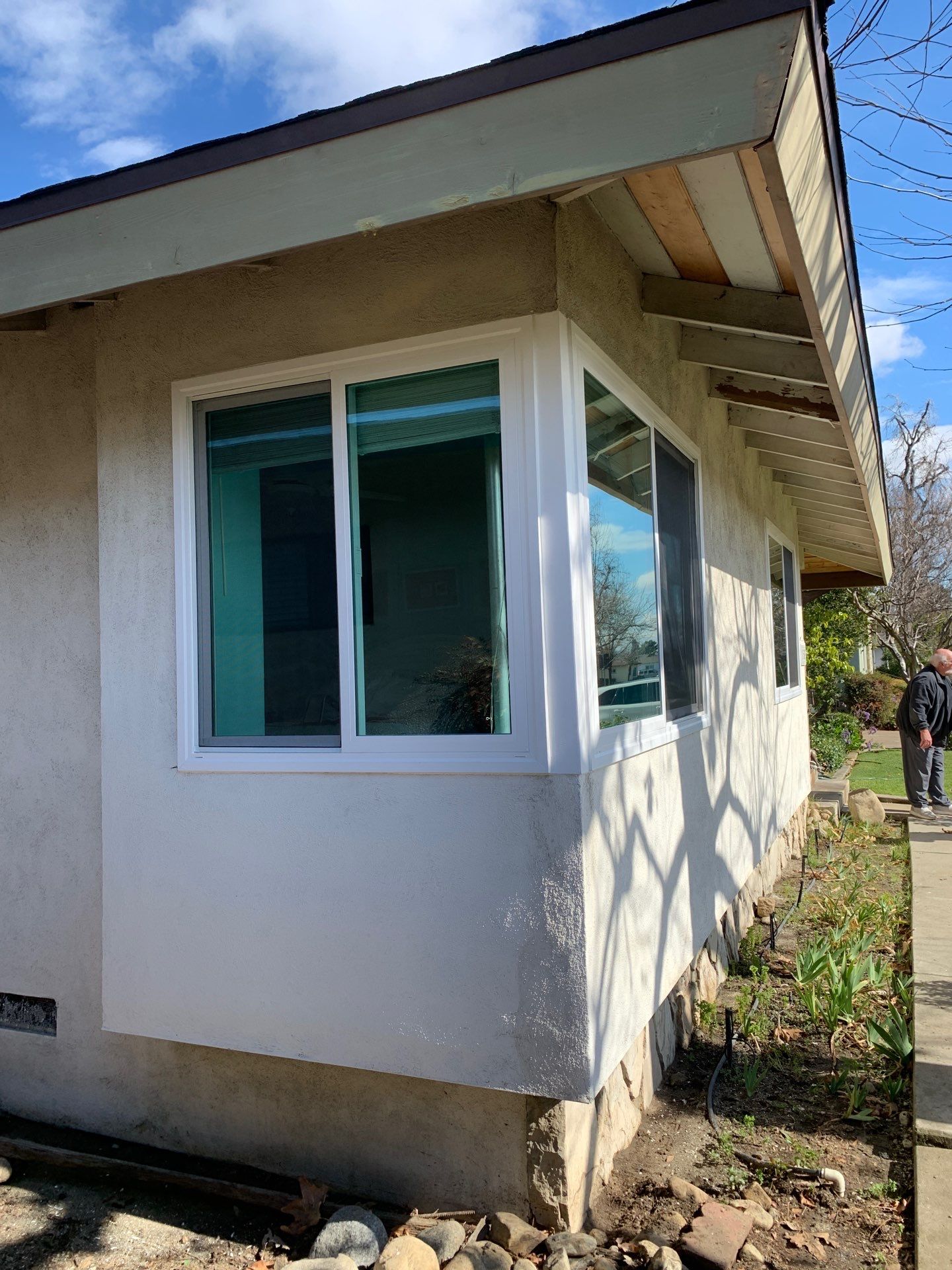 Window Installation using Black Vinyl Windows by American Window Company