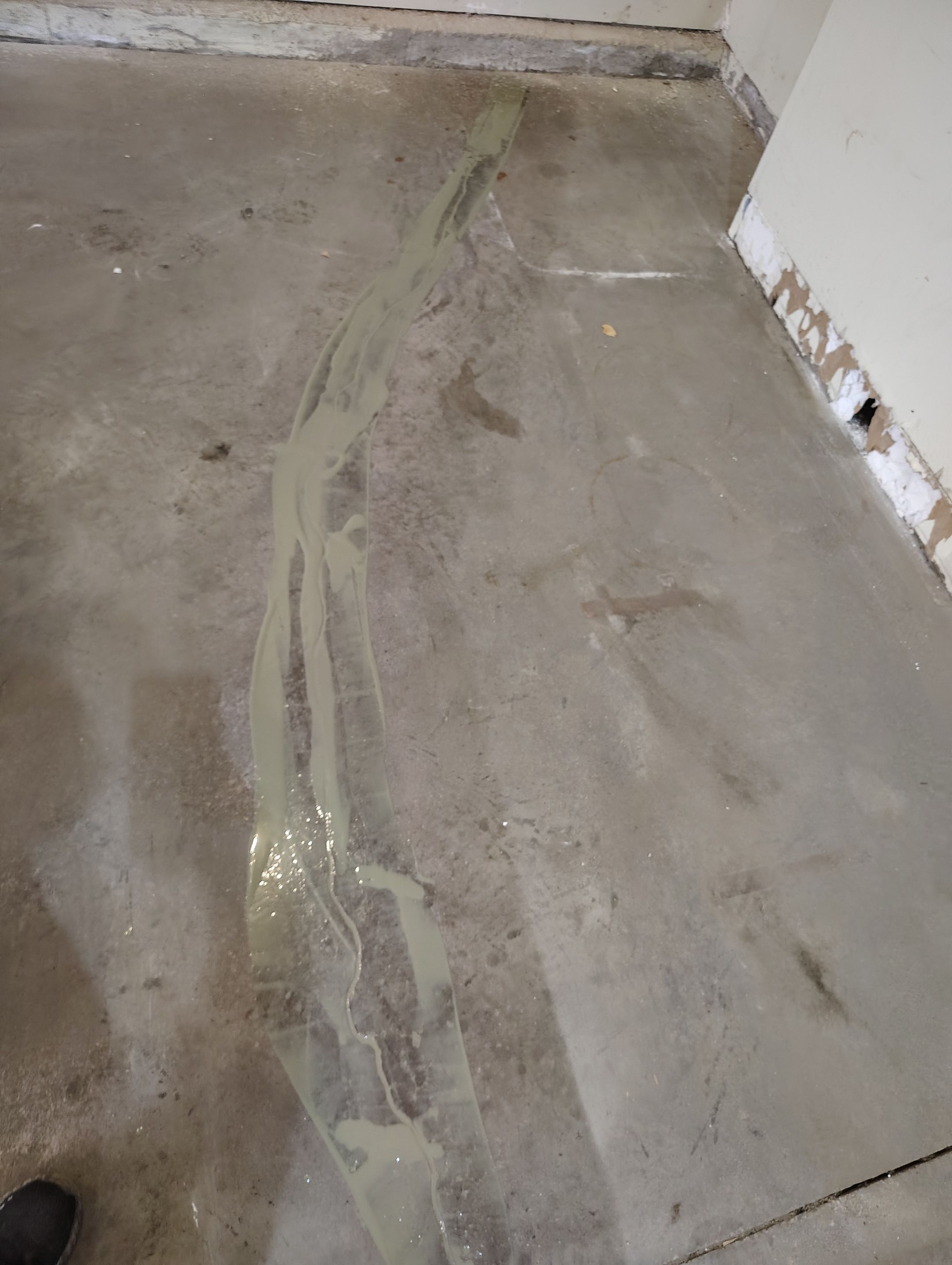 Sioux Falls Garage Floor Repair and Speckled Epoxy Coating Installation by Select Painting, Coatings & Garage Cabinets