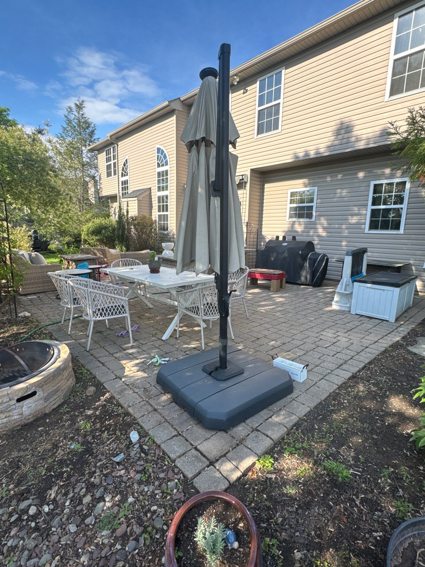 Backyard Retreat: Techo-Bloc Patio + Firepit Lounge by Saylor’s Lawn & Landscape