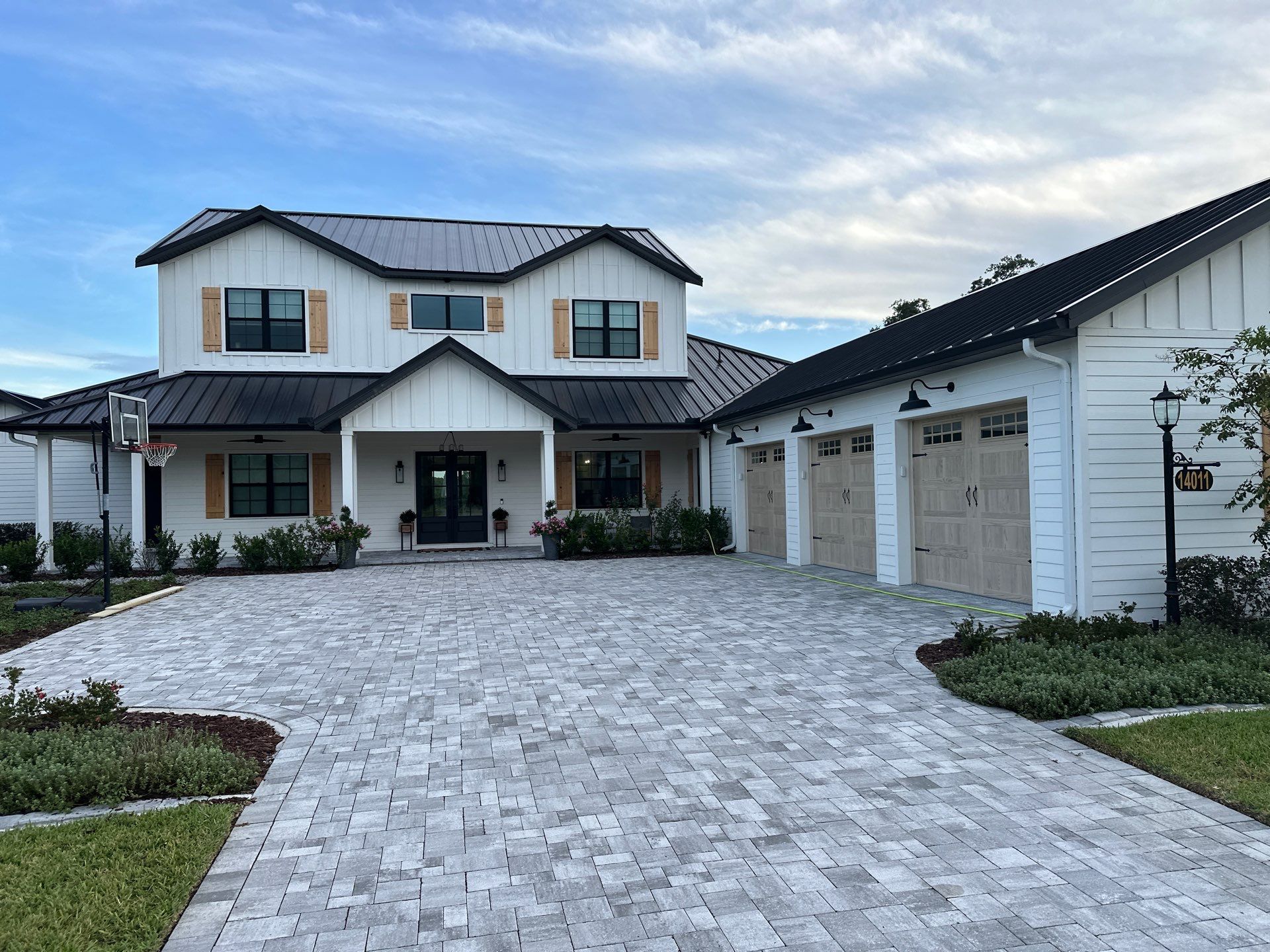 Complete Two-Story House Wash and Driveway Cleaning in Winding River Community, Bradenton, FL by Sunshine AquaWash
