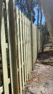 Pressure-Treated Vertical Shadowbox Wood Fence Installation in Sarasota