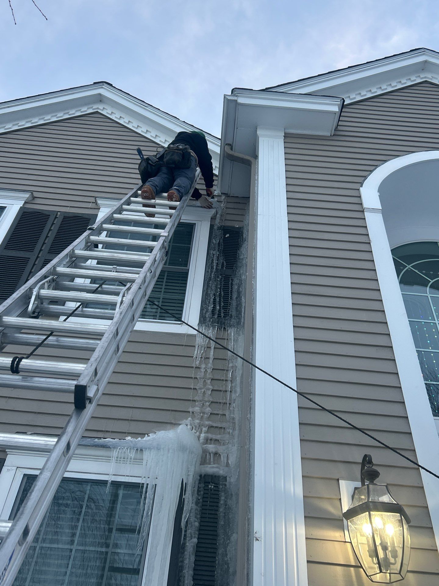 Ice Dam Removal Project in North Andover by Mighty Dog Roofing of Greater Middlesex County