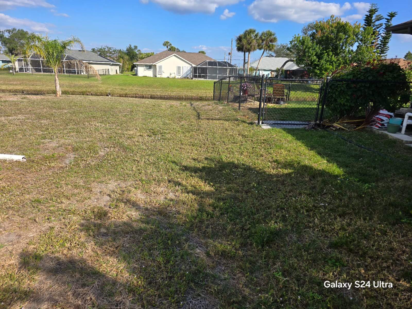 Waterfront Black Chain Link Fence Installation in Rotonda West by True Fence LLC