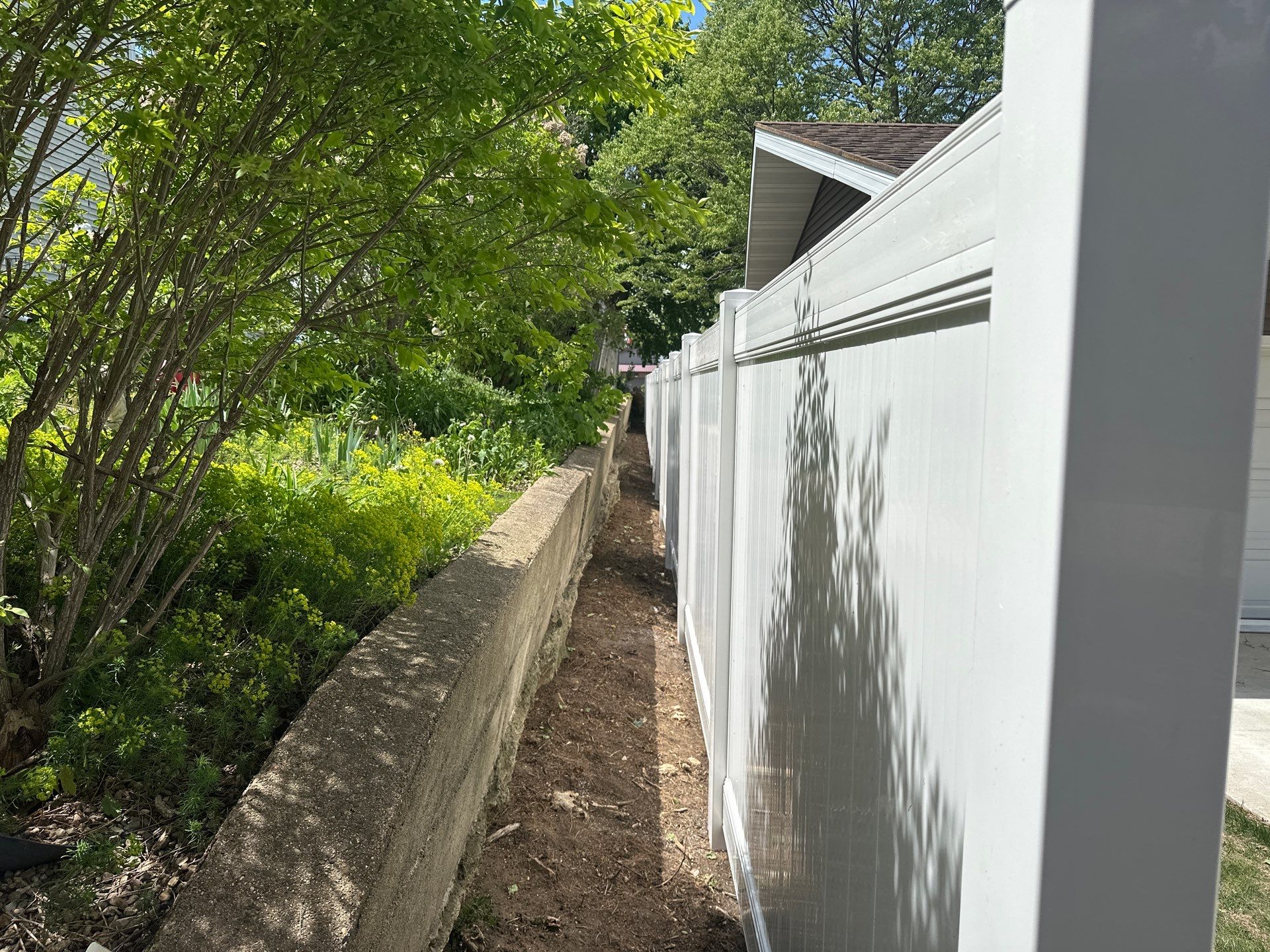 White Vinyl Privacy Fence Installation in Lawler, IA by Perfect Picket Fence and Stain