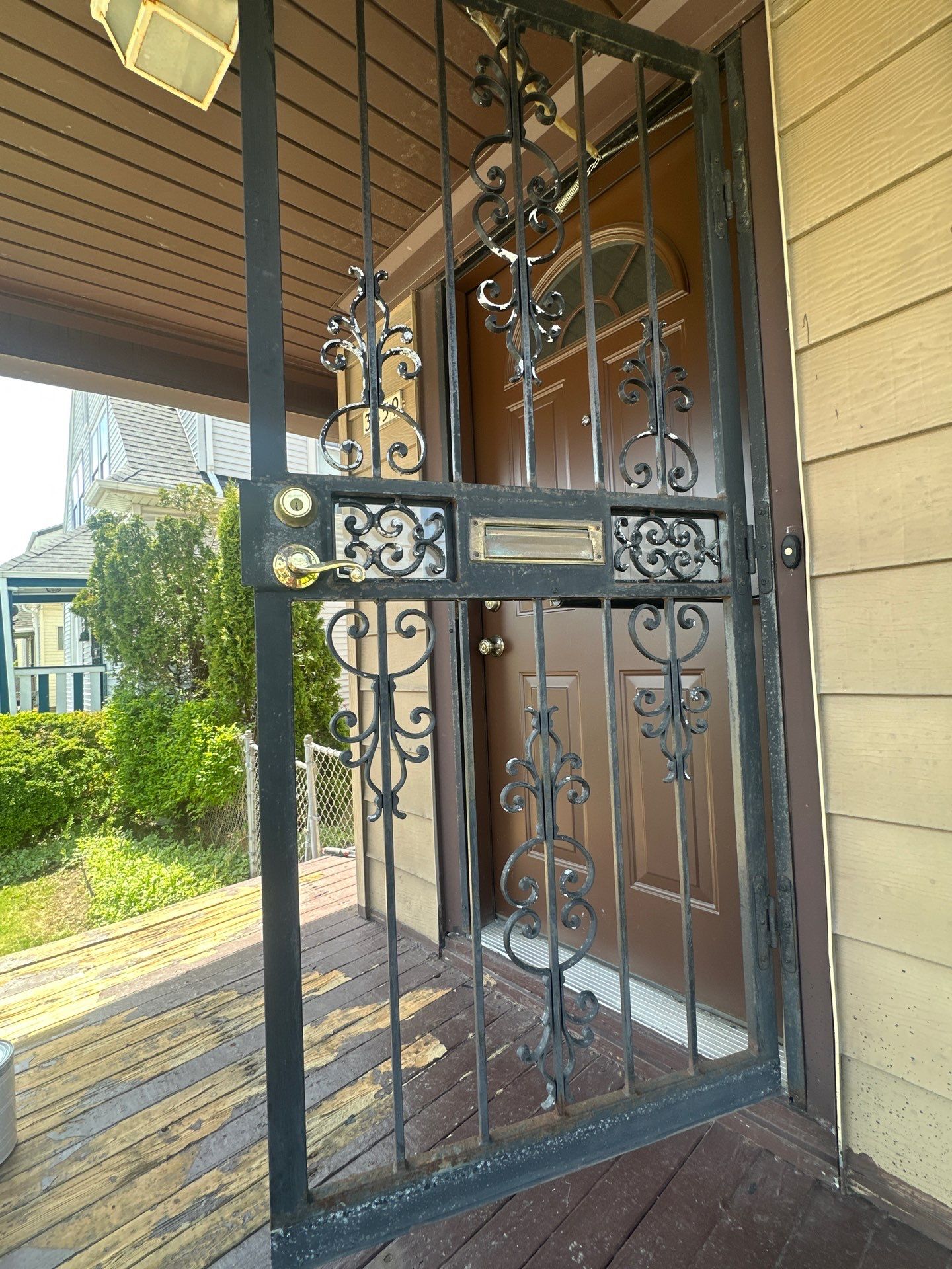 Milwaukee Exterior Porch Refinishing and Security Door Installation by OCS Contracting Services