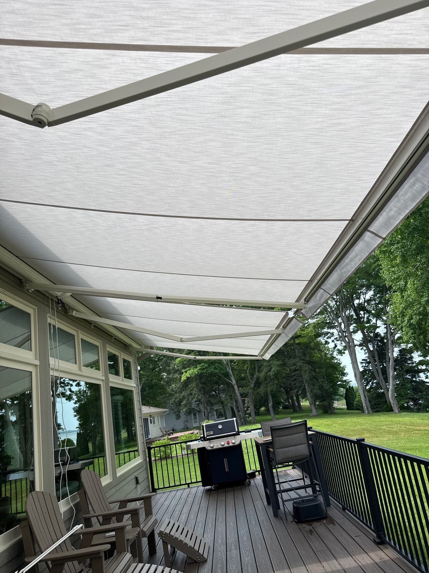Sunesta Retractable Awning Installation for Sault Sainte Marie Lakeside Deck by Rainbow Seamless Systems