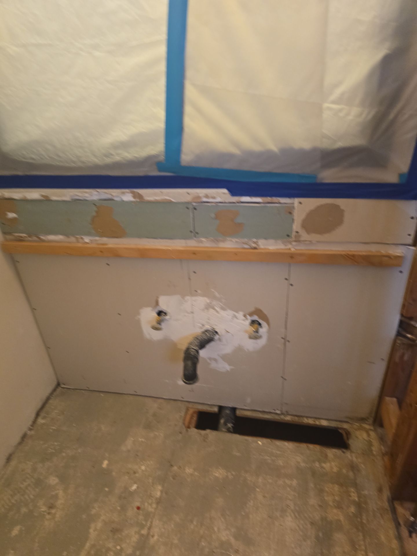 Inspecting Water Leak in Shower by Us Plumbing