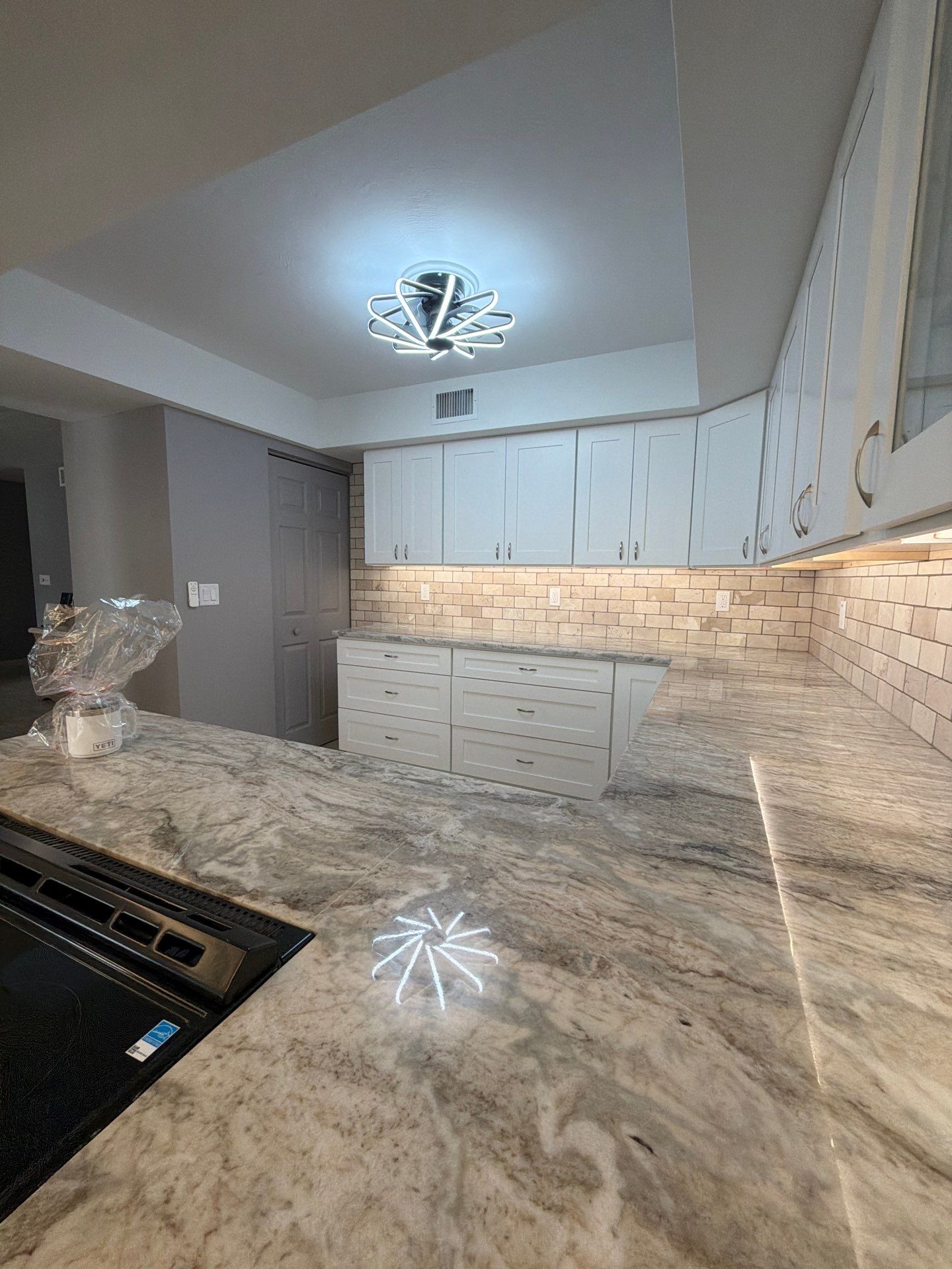 Completely Re-imagined Modern Condominium Kitchen Remodel  by Acies Renovations