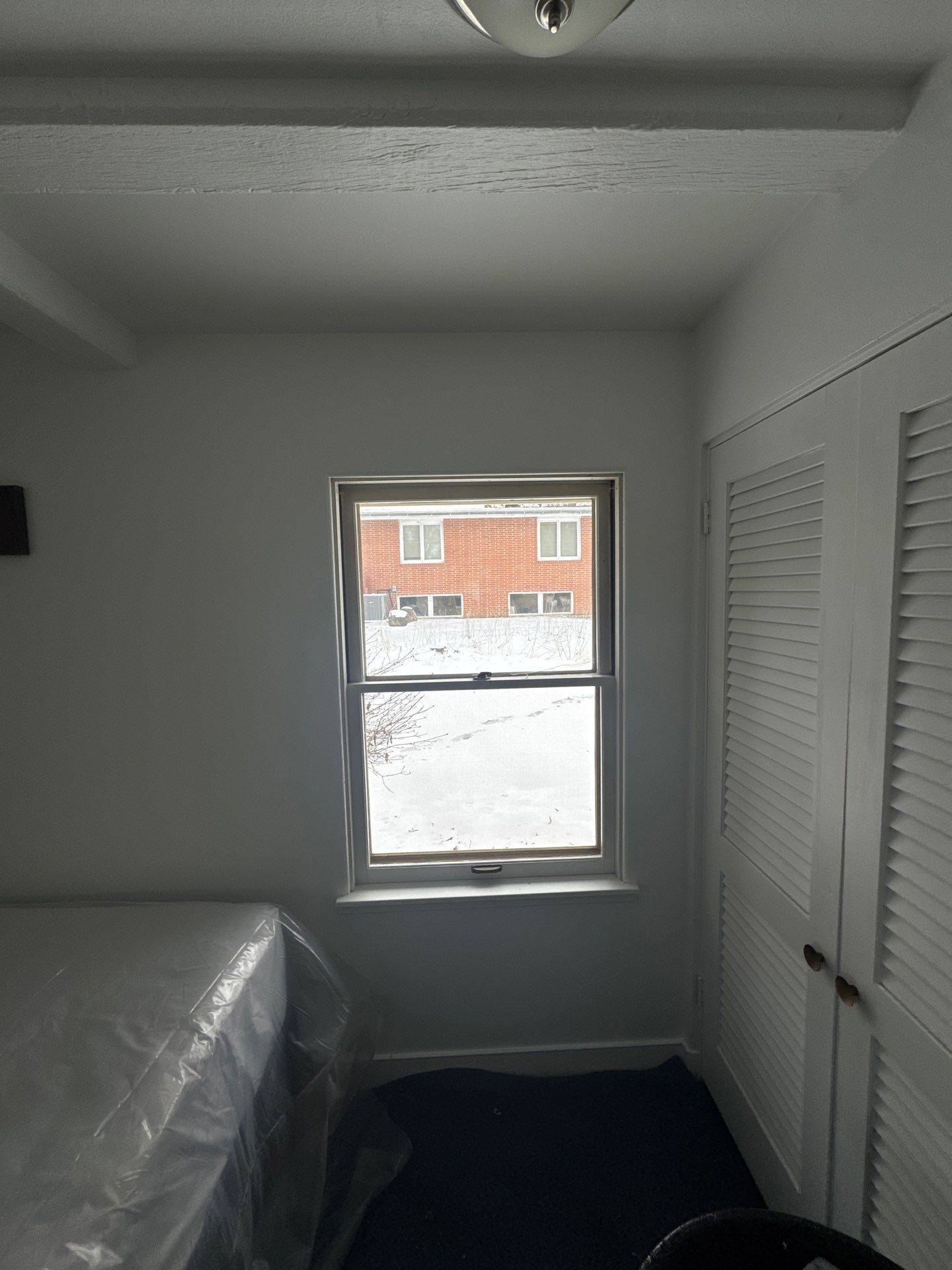 Black-Frame Pella Lifestyle Upgrade on a Partial Brick Home by United Windows and Siding LLC