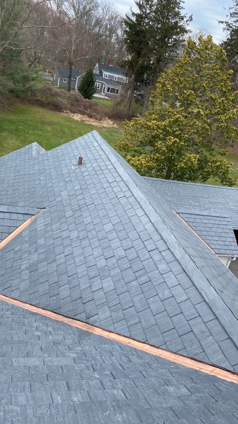 Residential Roofing Installation using Vermont Slate by A Plus Exterior