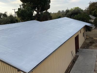 Metal roof sprayed with polyurethane spray foam and coatings