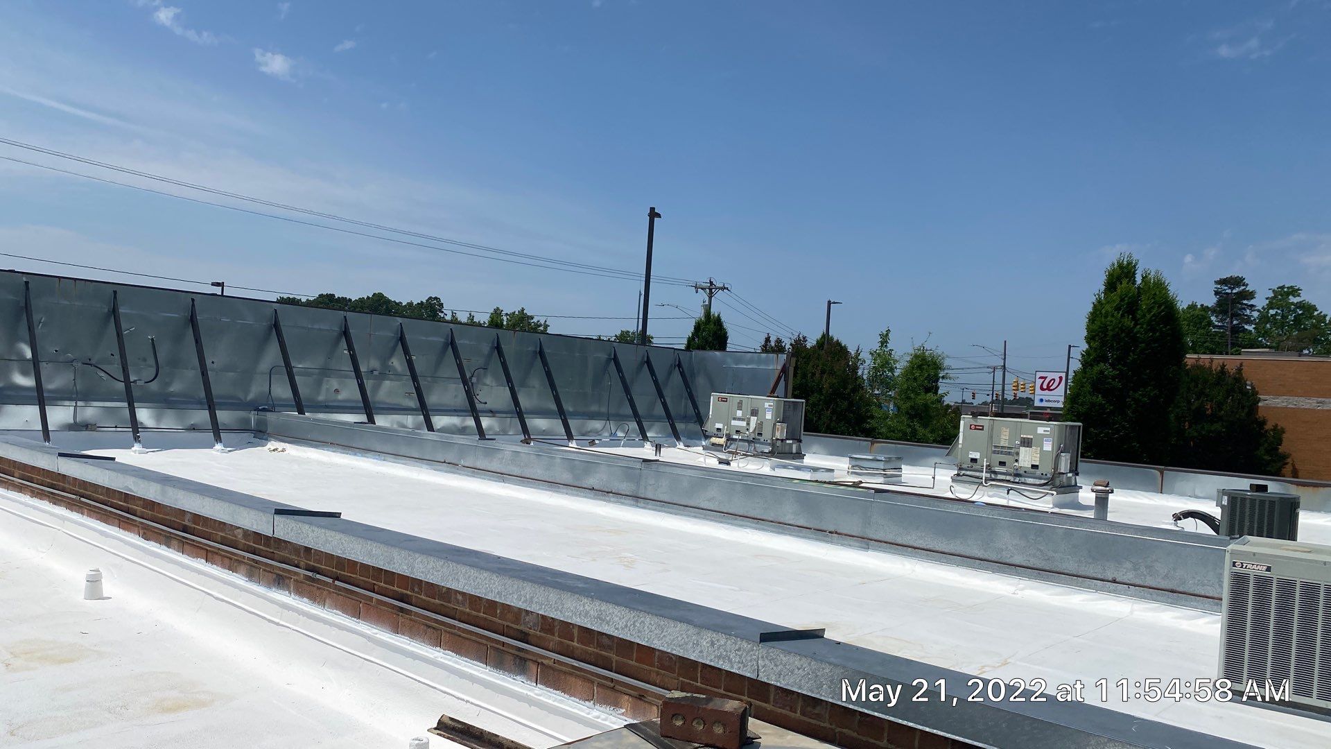 Commercial Roof Coating using Fiberseal basecoat and Silicon Topcoat by Just In Time Roofing and Restoration