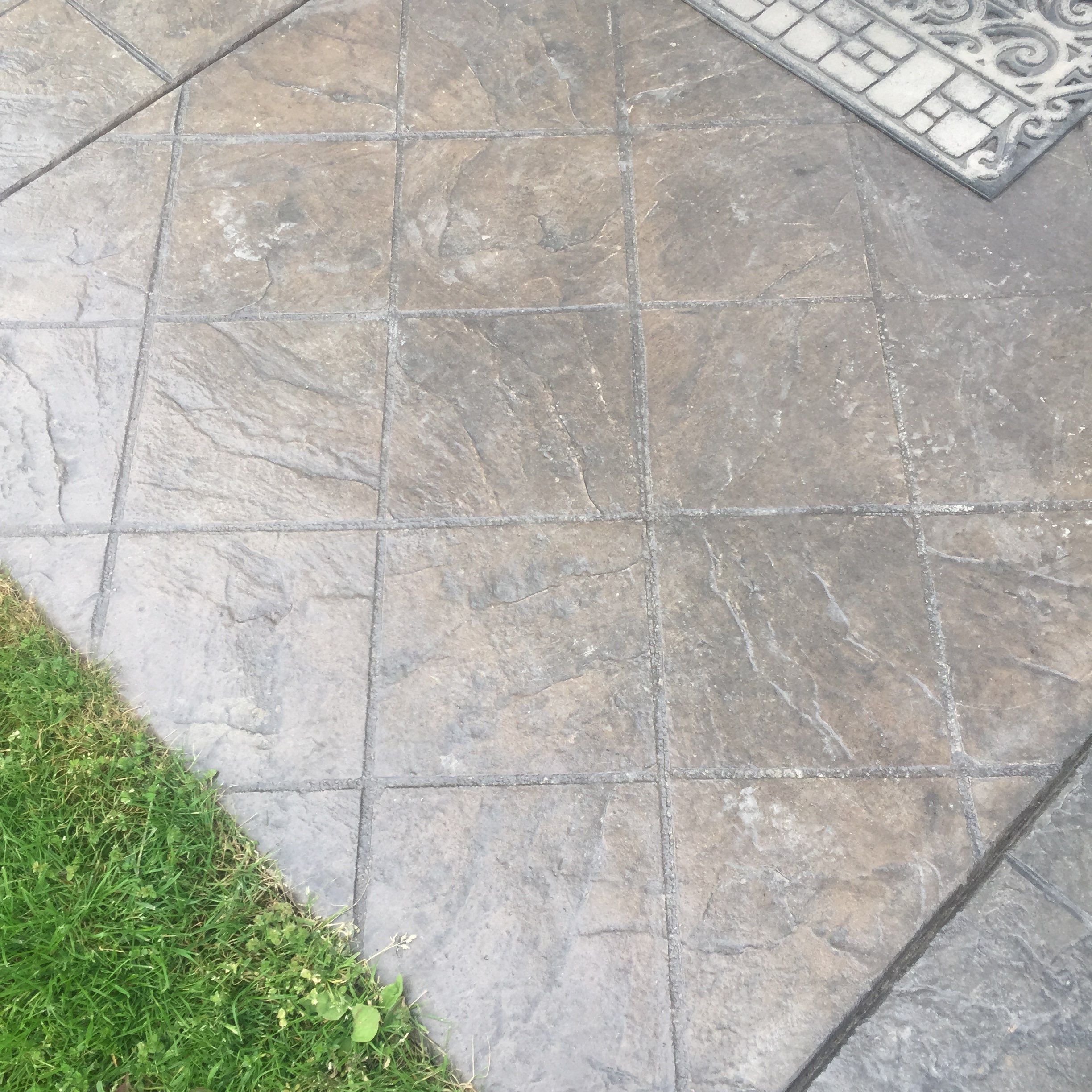 Asphalt Driveway and Stamped Concrete Patio Finish  by Jireh Asphalt & Concrete Inc 