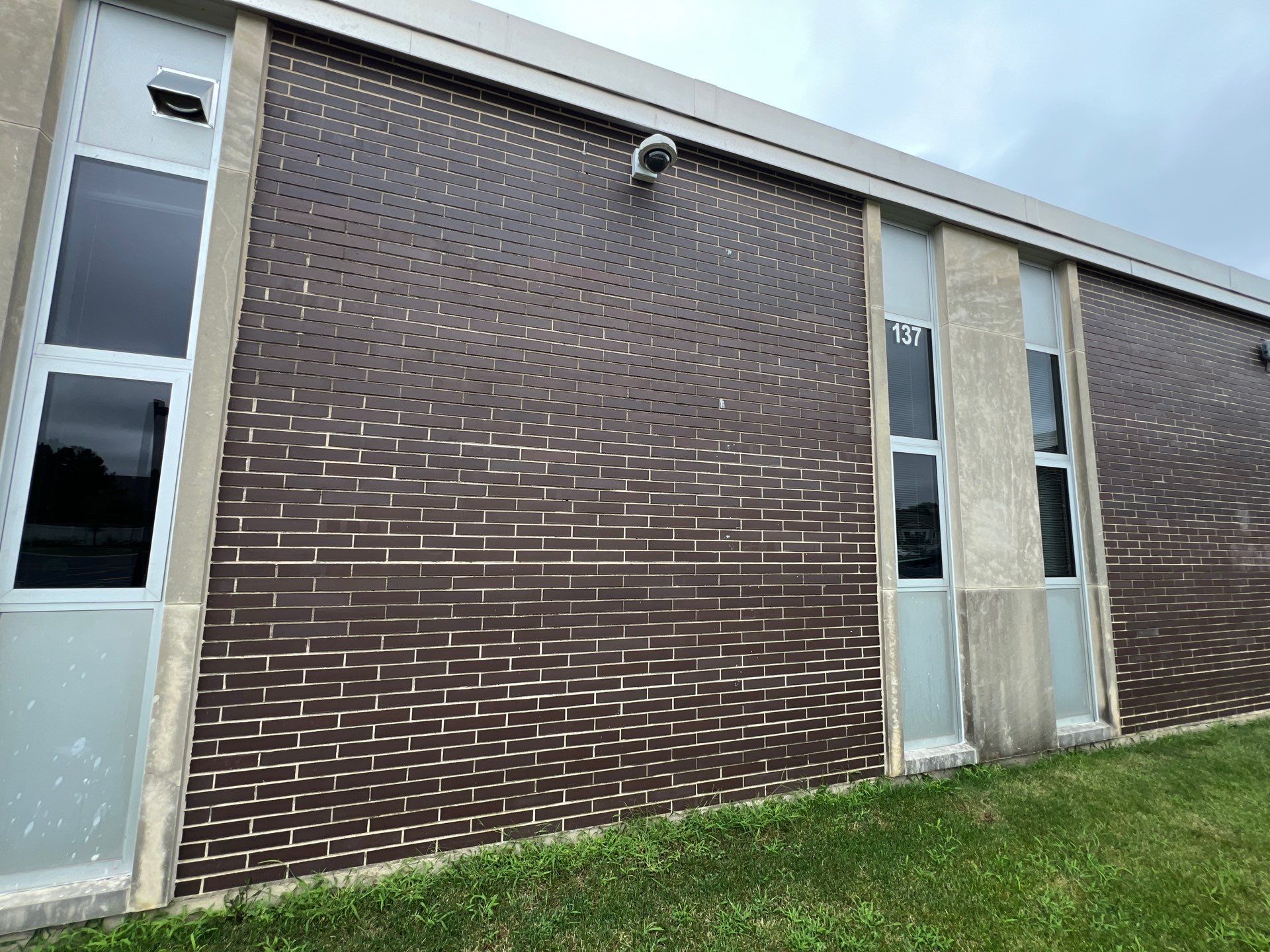 commercial pressure washing using Algaecide, soft wash soap by Northern Power Washing LLC.