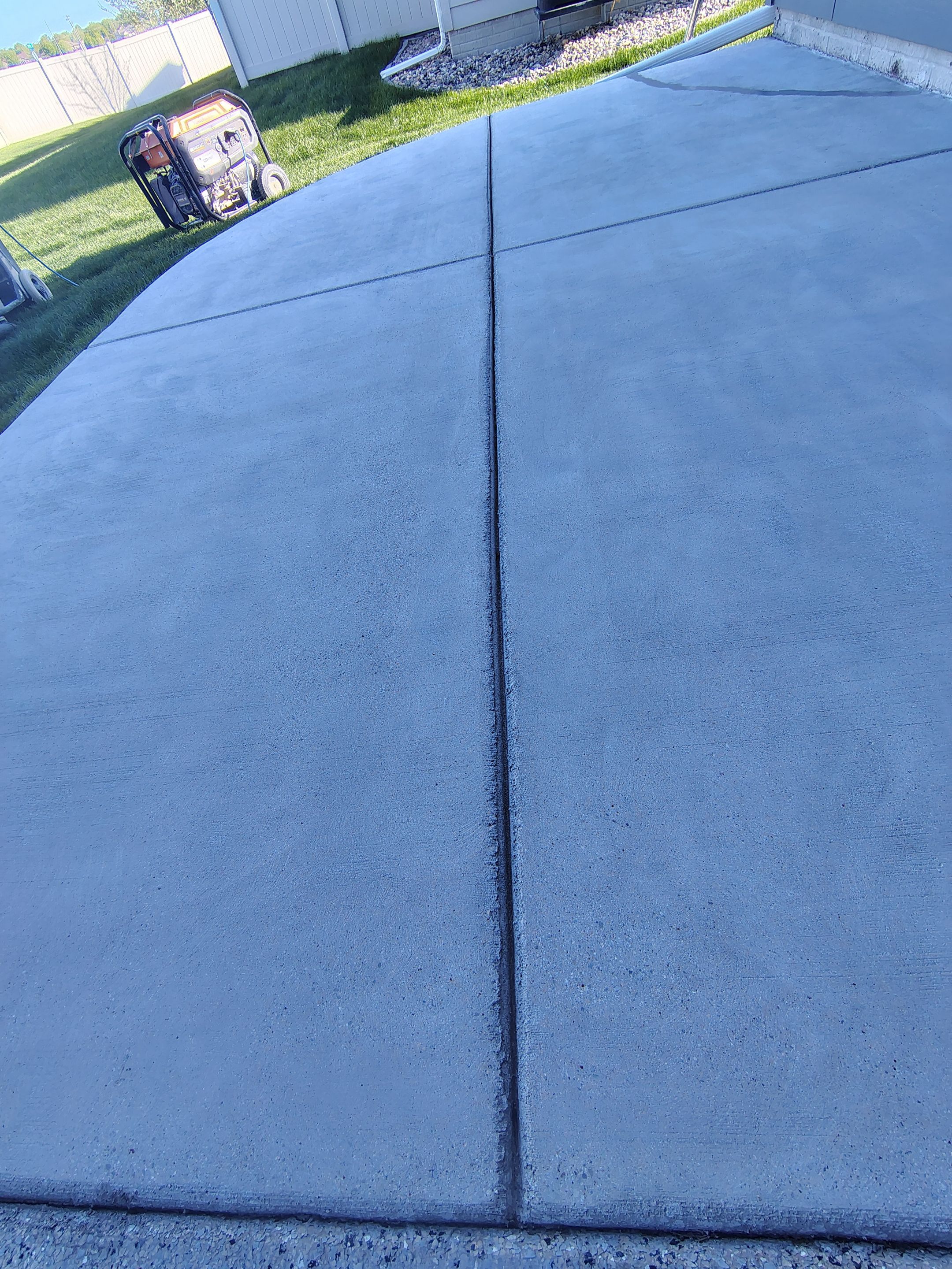 Speckled Concrete Patio Coating Installation in Sioux Falls by Select Painting, Coatings & Garage Cabinets