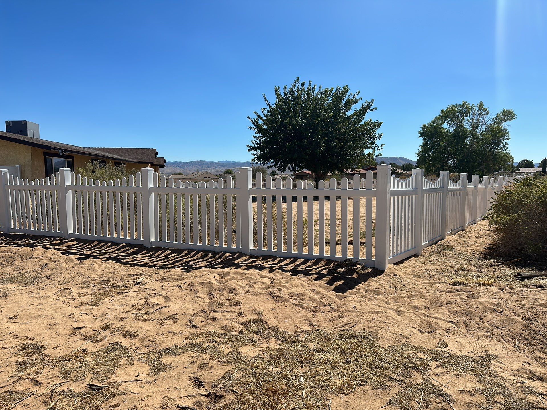 White picket fence  by Fence Guys Inc. 