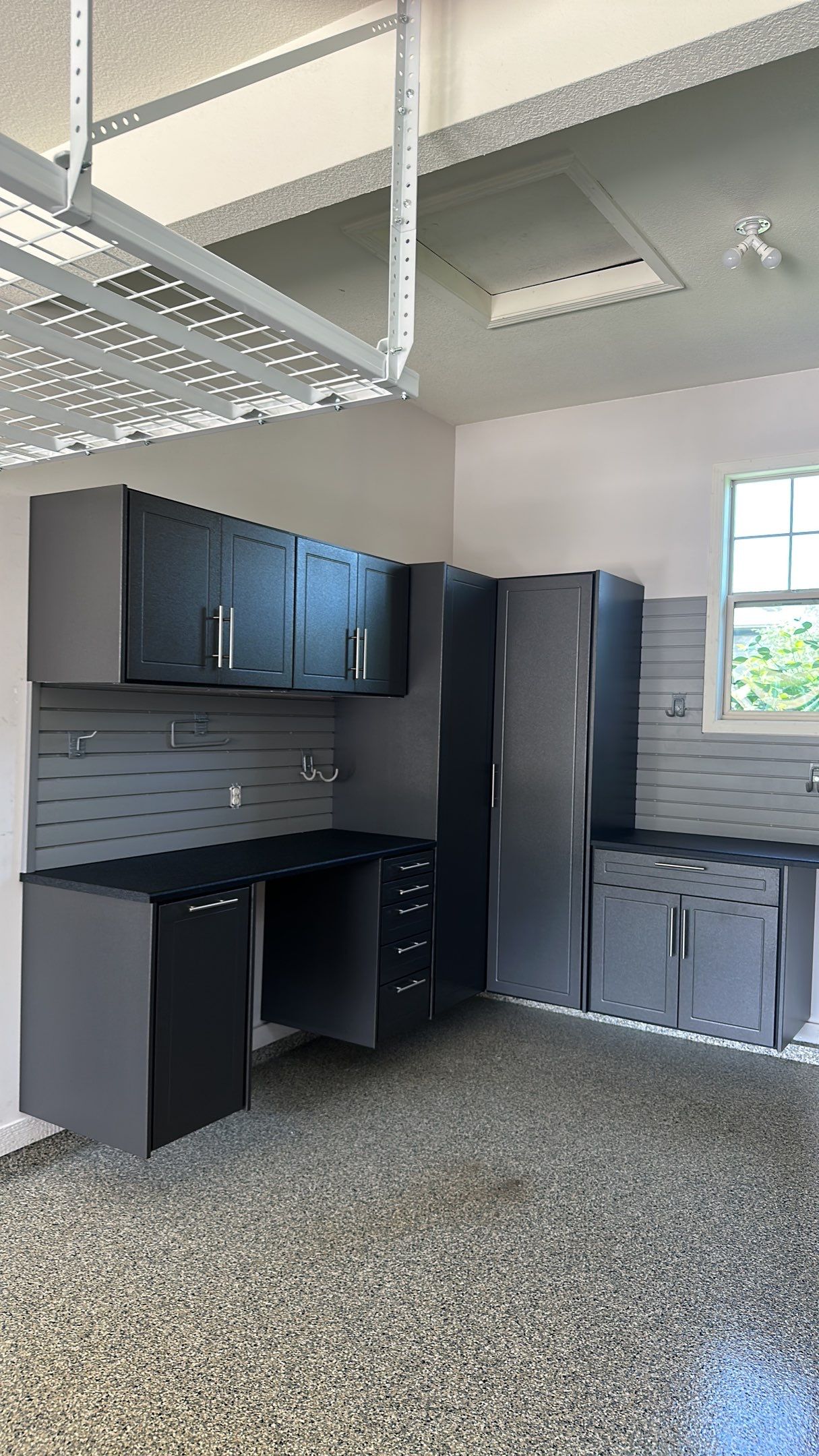 Lori H. upgrade her garage with cabinets and overhead racks by Banner Garage