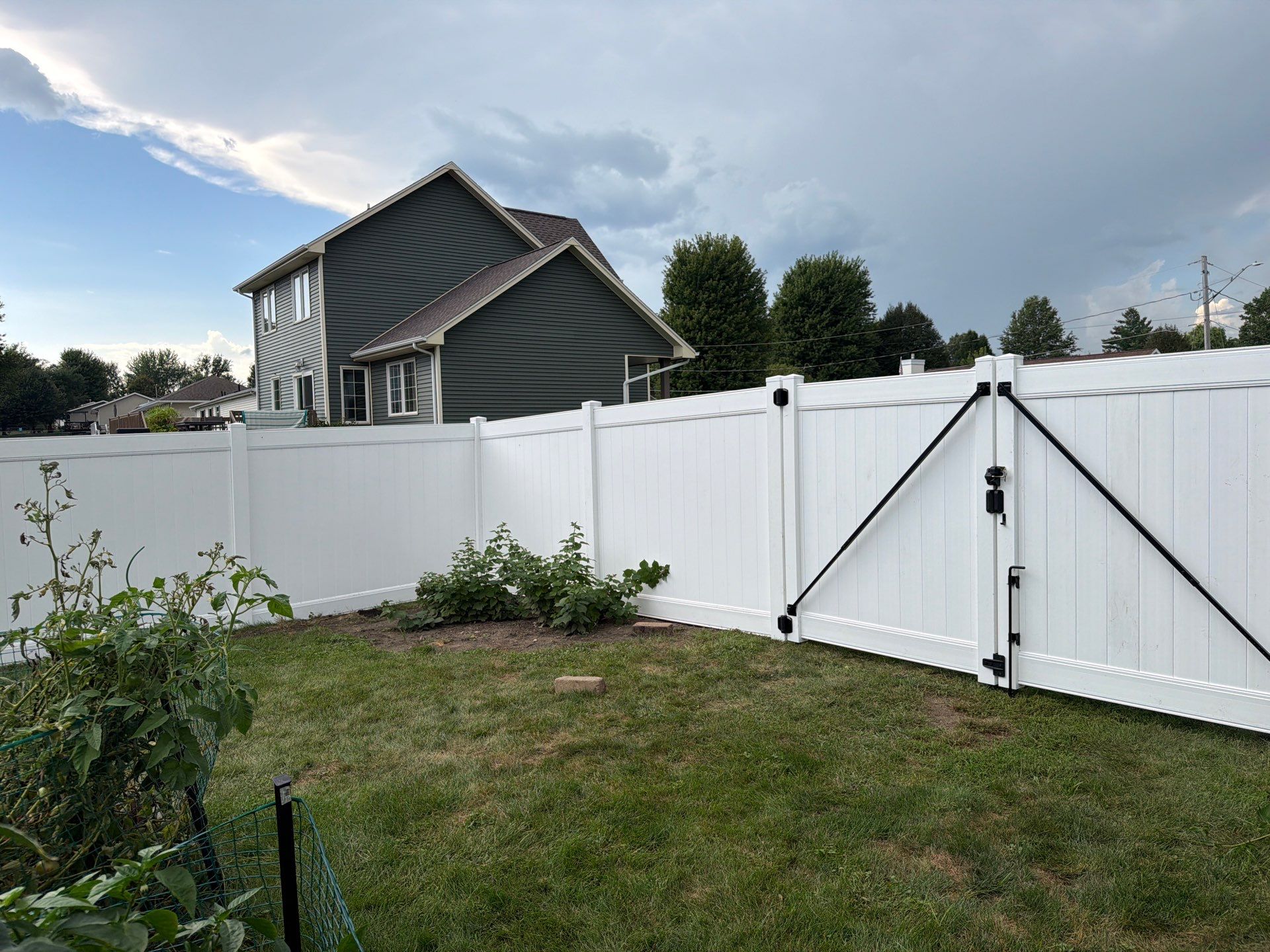White Vinyl Privacy Fence Installation in Raymond, IA by Perfect Picket Fence and Stain