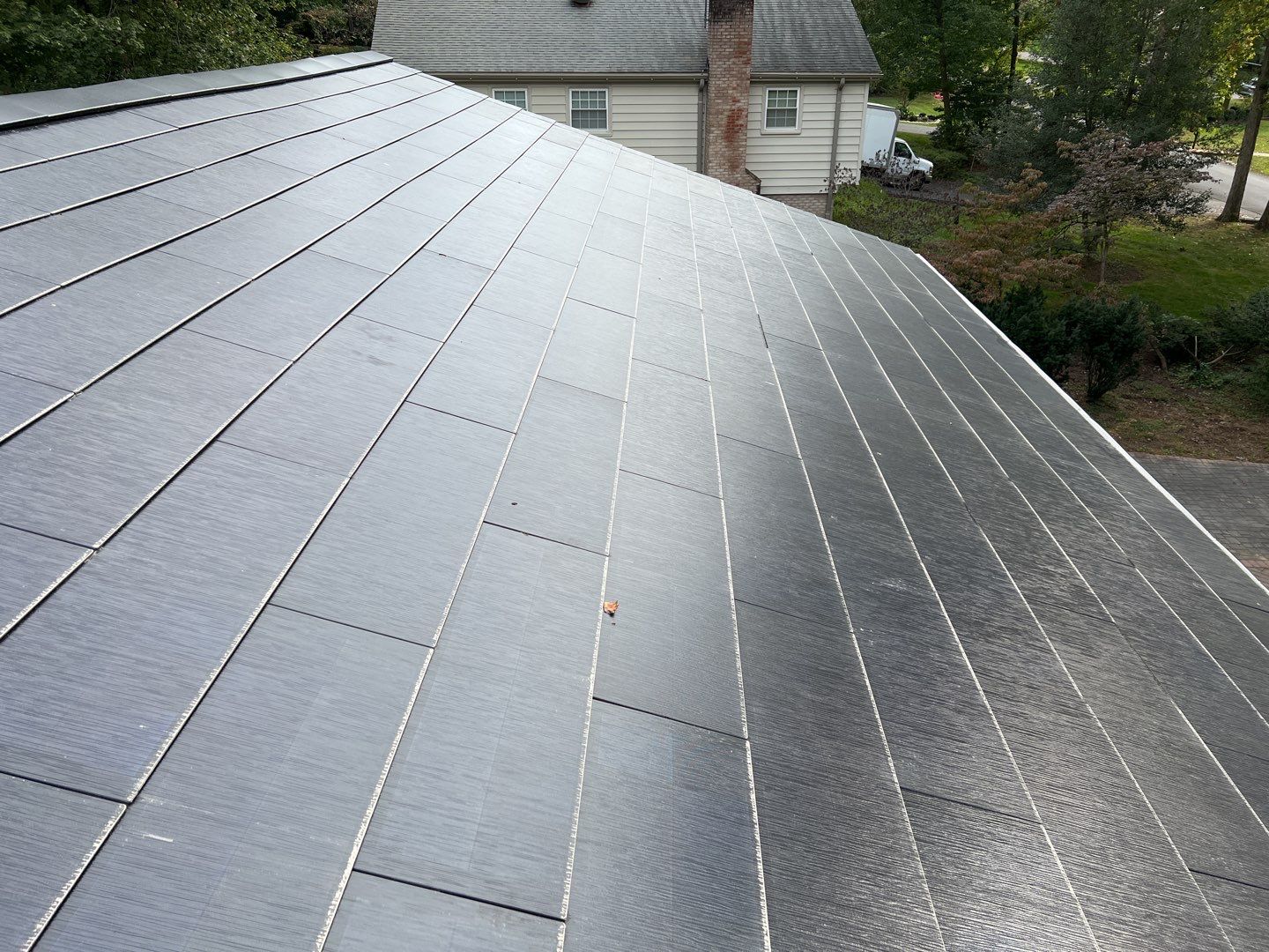 Tesla Solar Roof Replacement using Tesla Solar Roof V3 Tiles by American Home Contractors