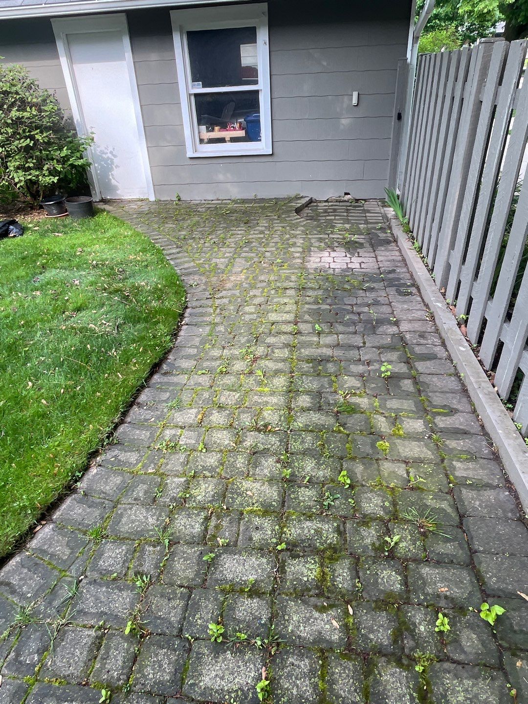 Brick paver cleaning and sealing by Northern Power Washing LLC.
