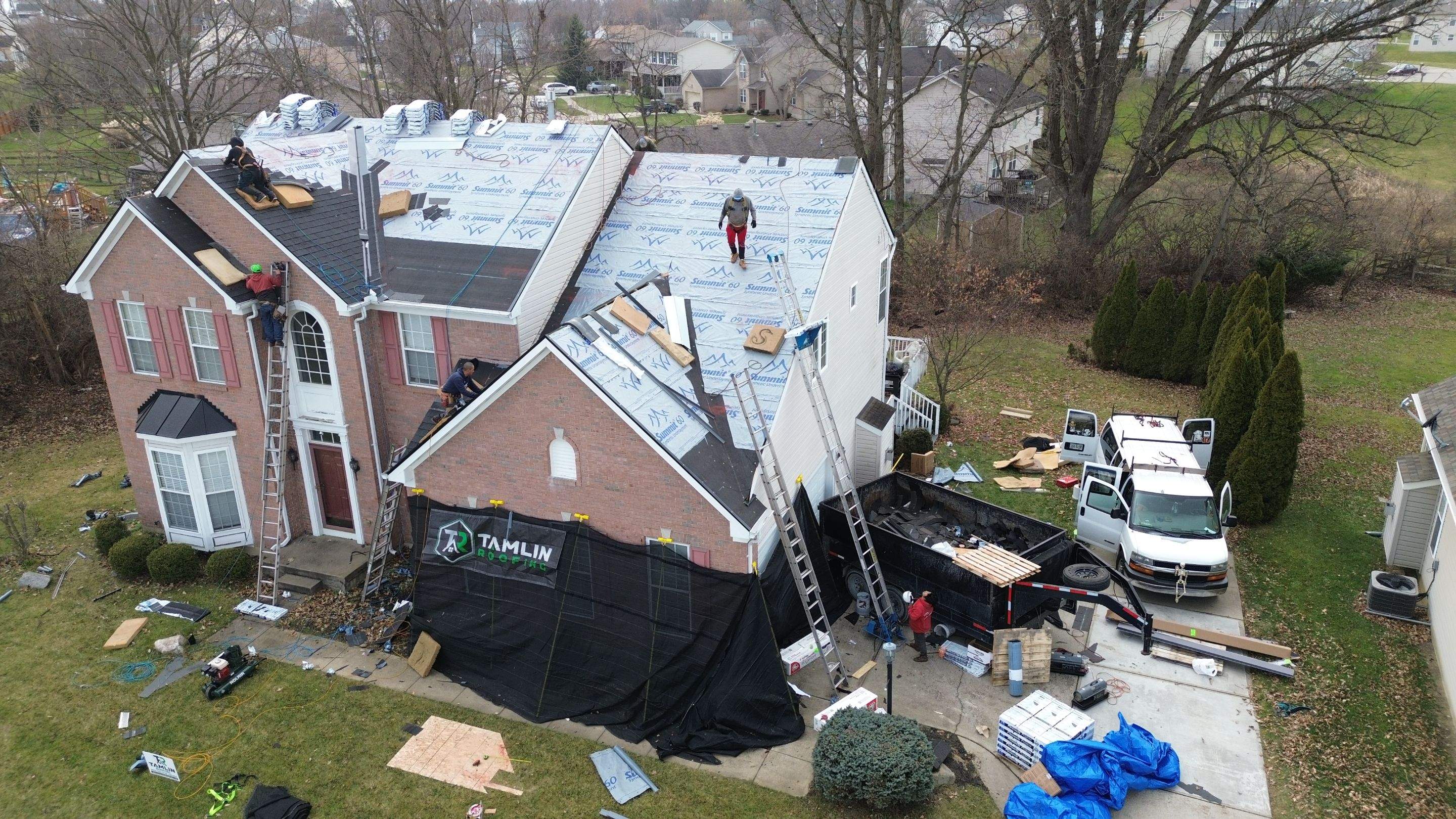 Walden Ponds - Pristine Black and Hydro Flo Gutter Guards by Tamlin Roofing