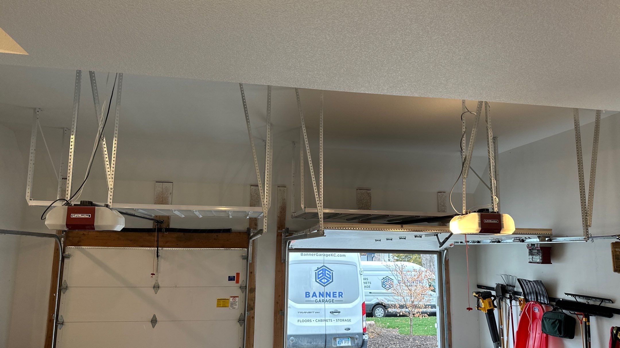 Max R. upgraded his garage with overhead racks and a New floor  by Banner Garage