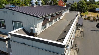 Commercial Flat Roof Installation using Bruce and Dana Snap Lock Metal (Color: Brown)