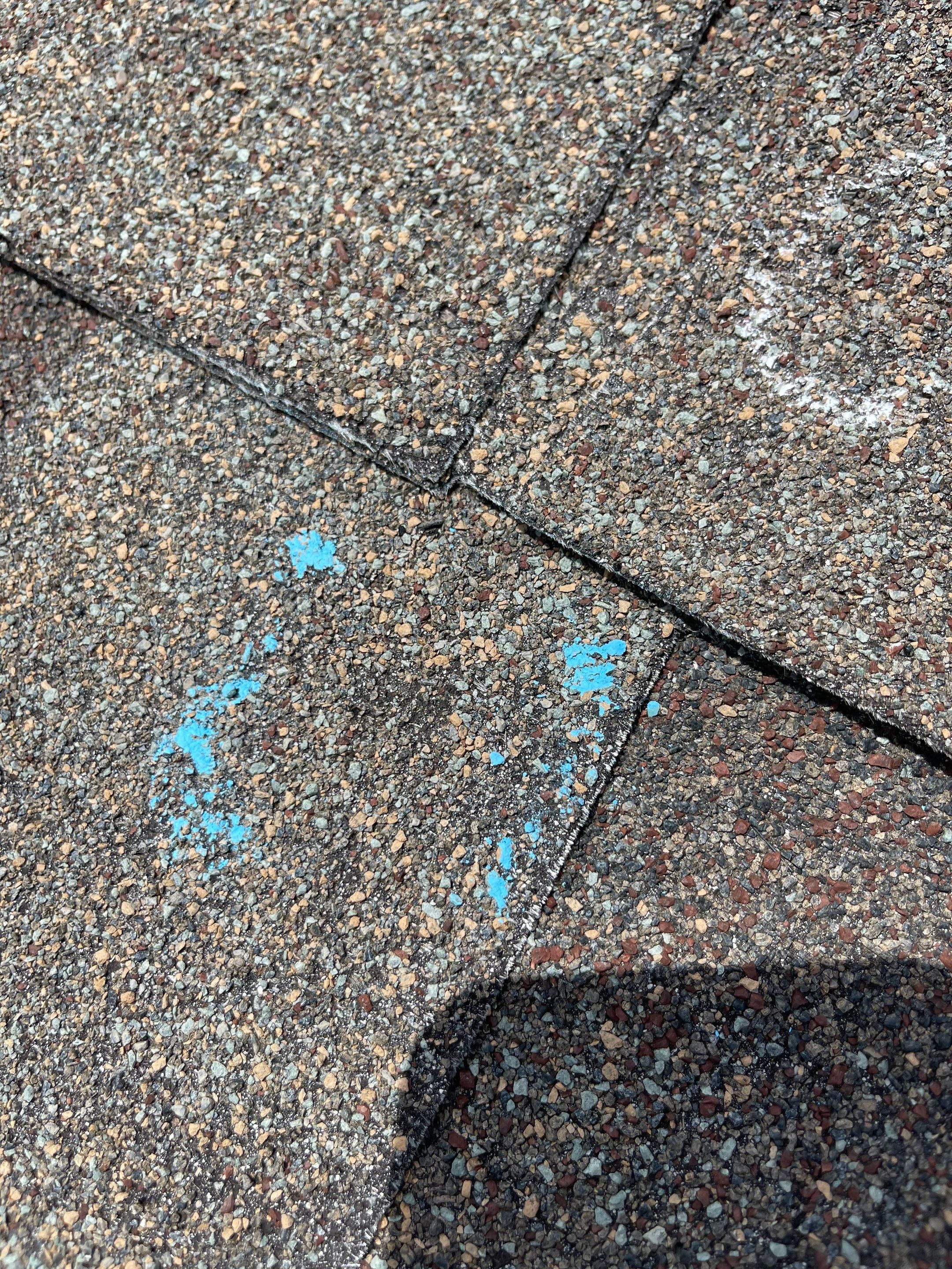 Hail Damage on a Roofing System by Icon Roofing And Construction 