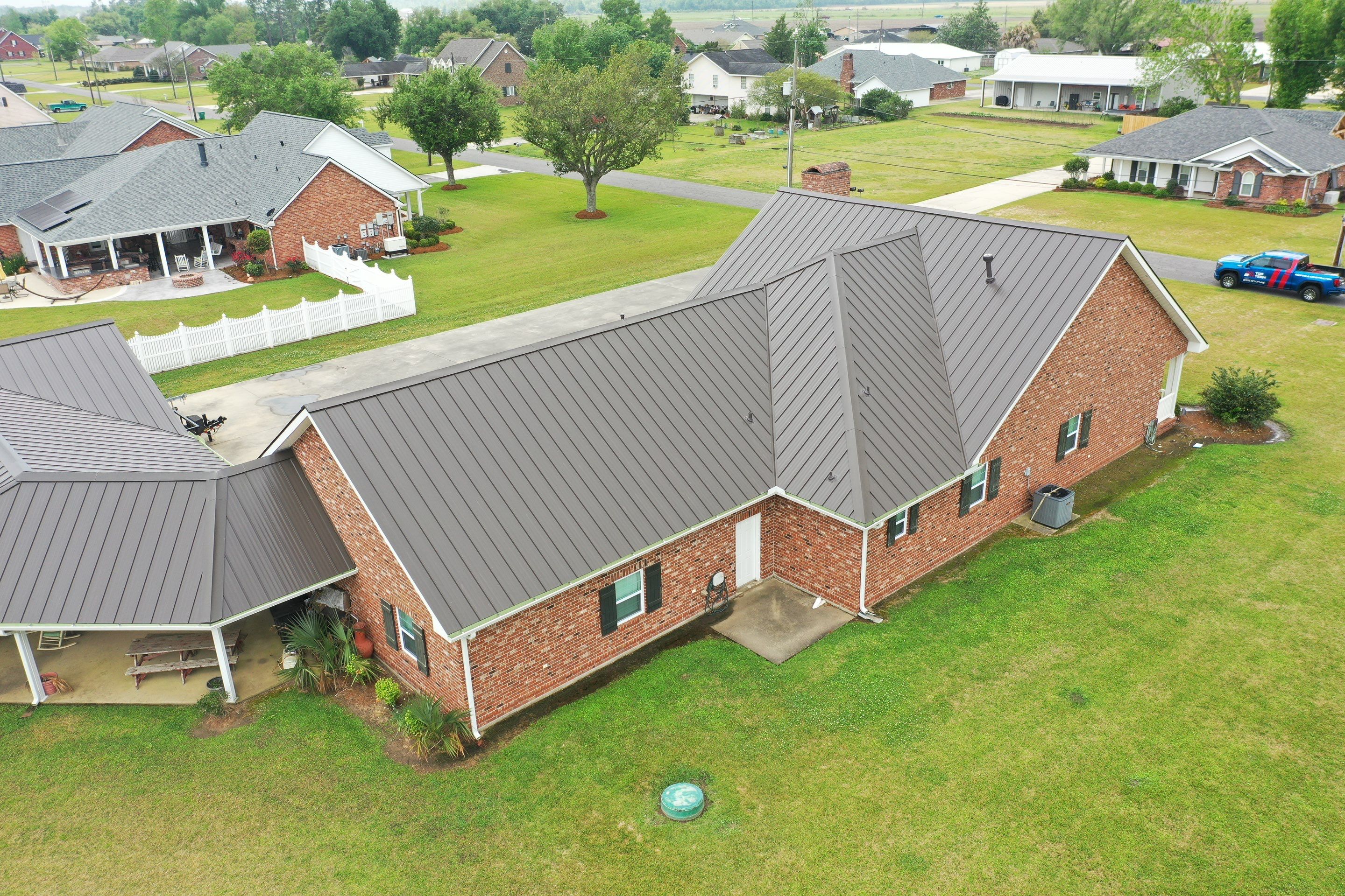Standing Seam Metal Roof Installation by Top Team Roofing & Construction