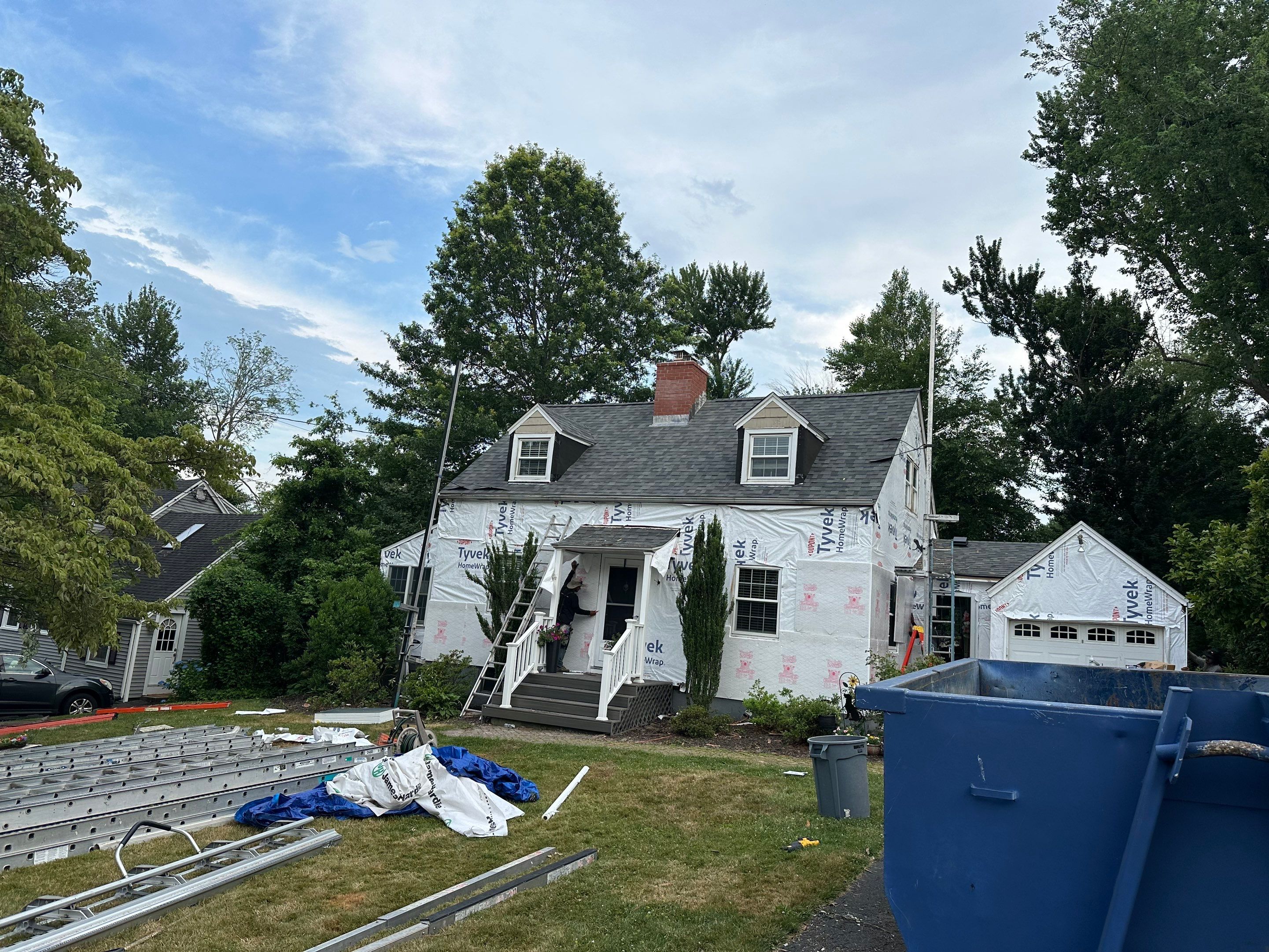 Complete Exterior Estate gray with Pacific Blue Siding by A Plus Exterior